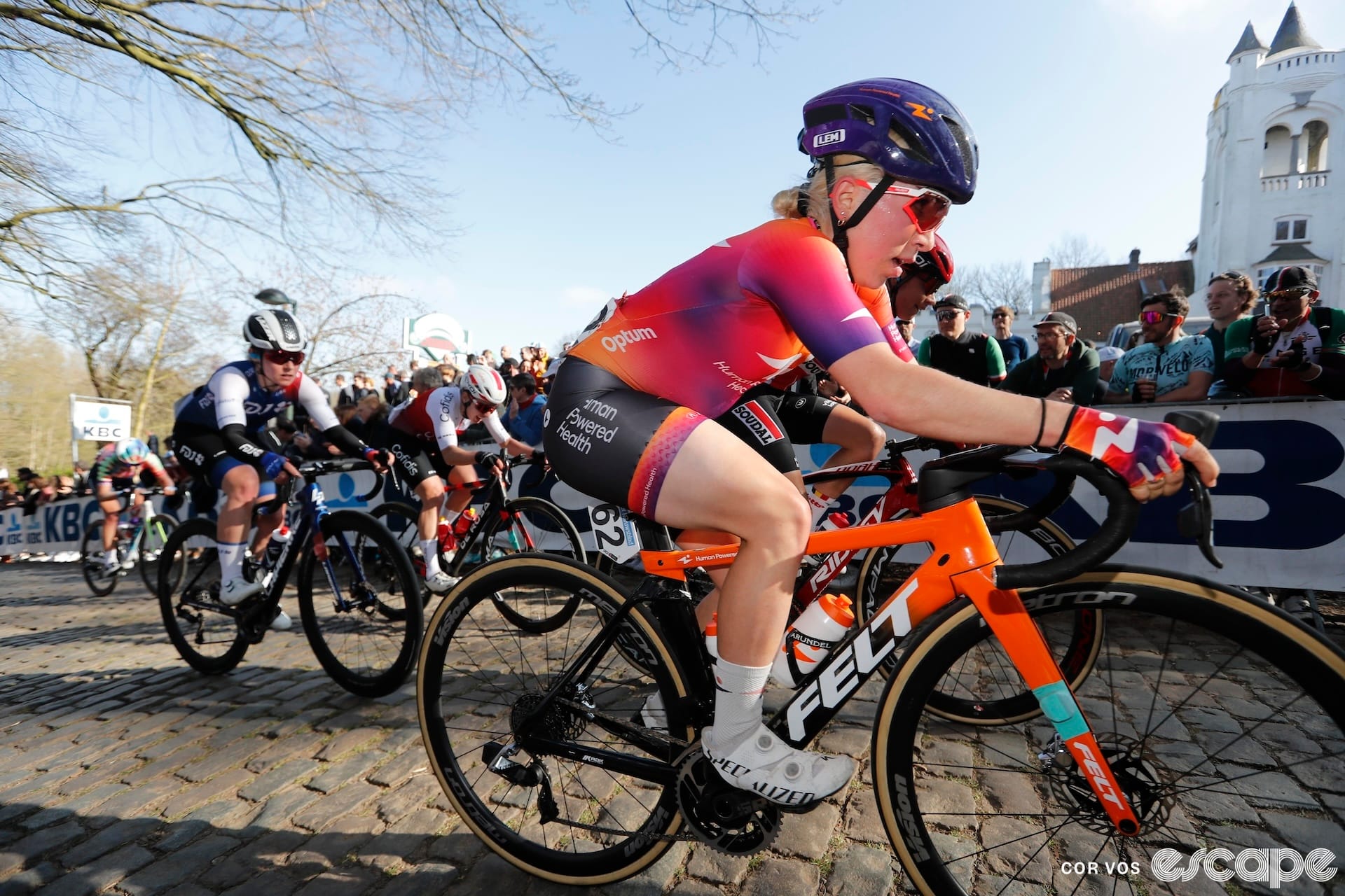 Kaia Schmid races over cobblestones at Gent-Wevelgem.