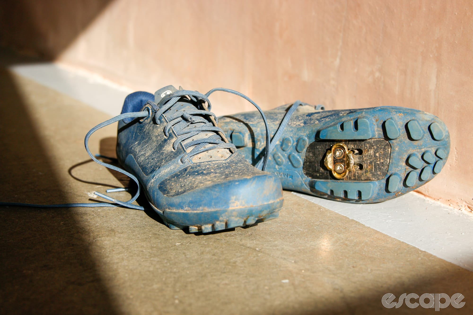 blue crankbrothers shoes in sunlight, showing sole and upper