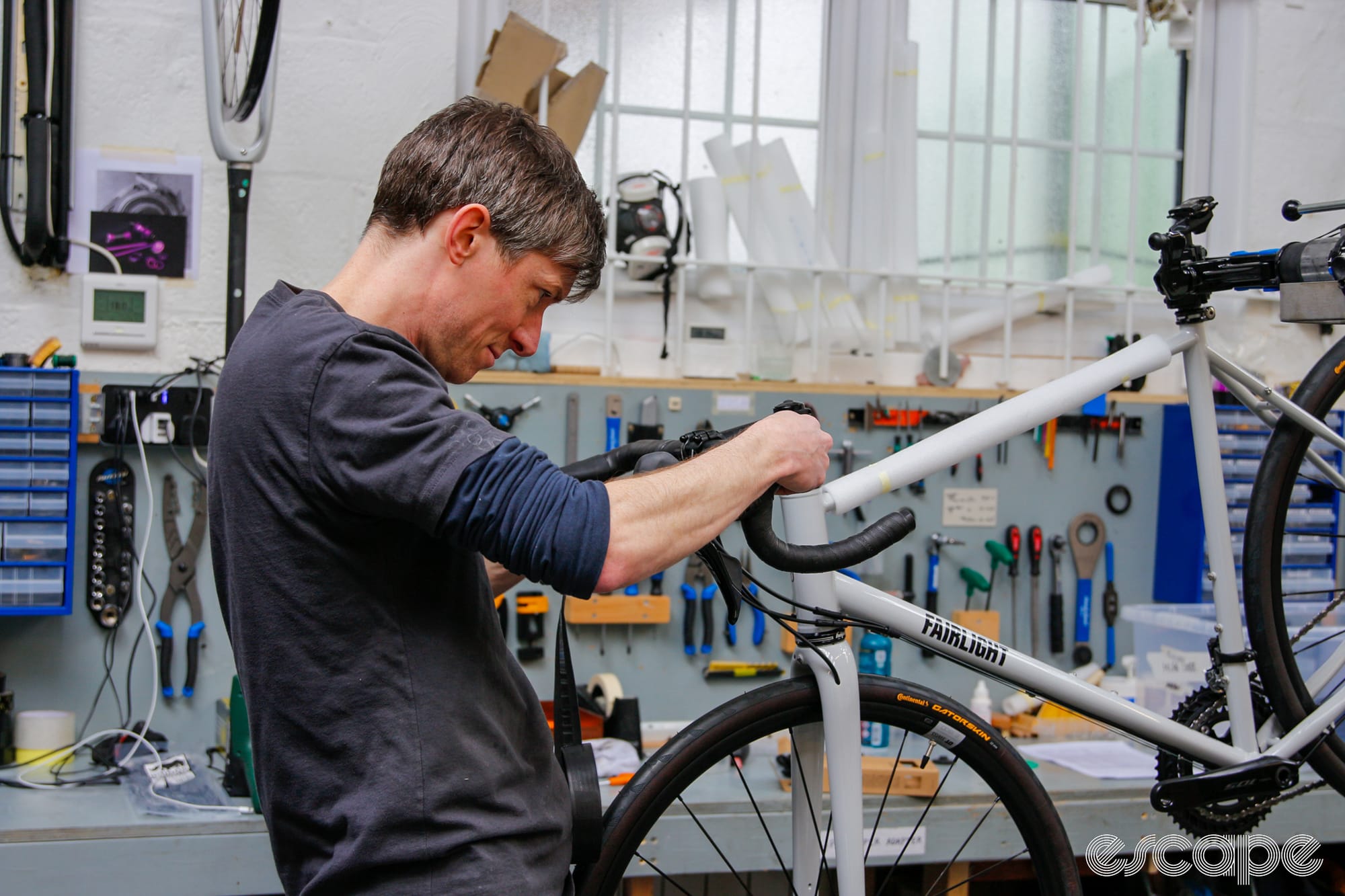 Man wrapping bar tape