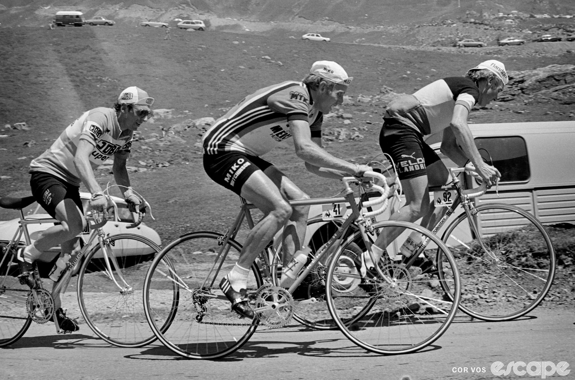 Three riders climb a pass in the 1978 Tour, in a black and white image. They're wearing wool kit and cycling caps.