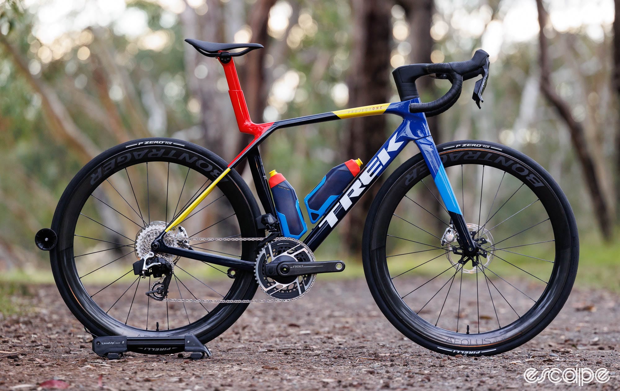 Trek madone with lidl trek team colours, equipped with two matching aero bottles.