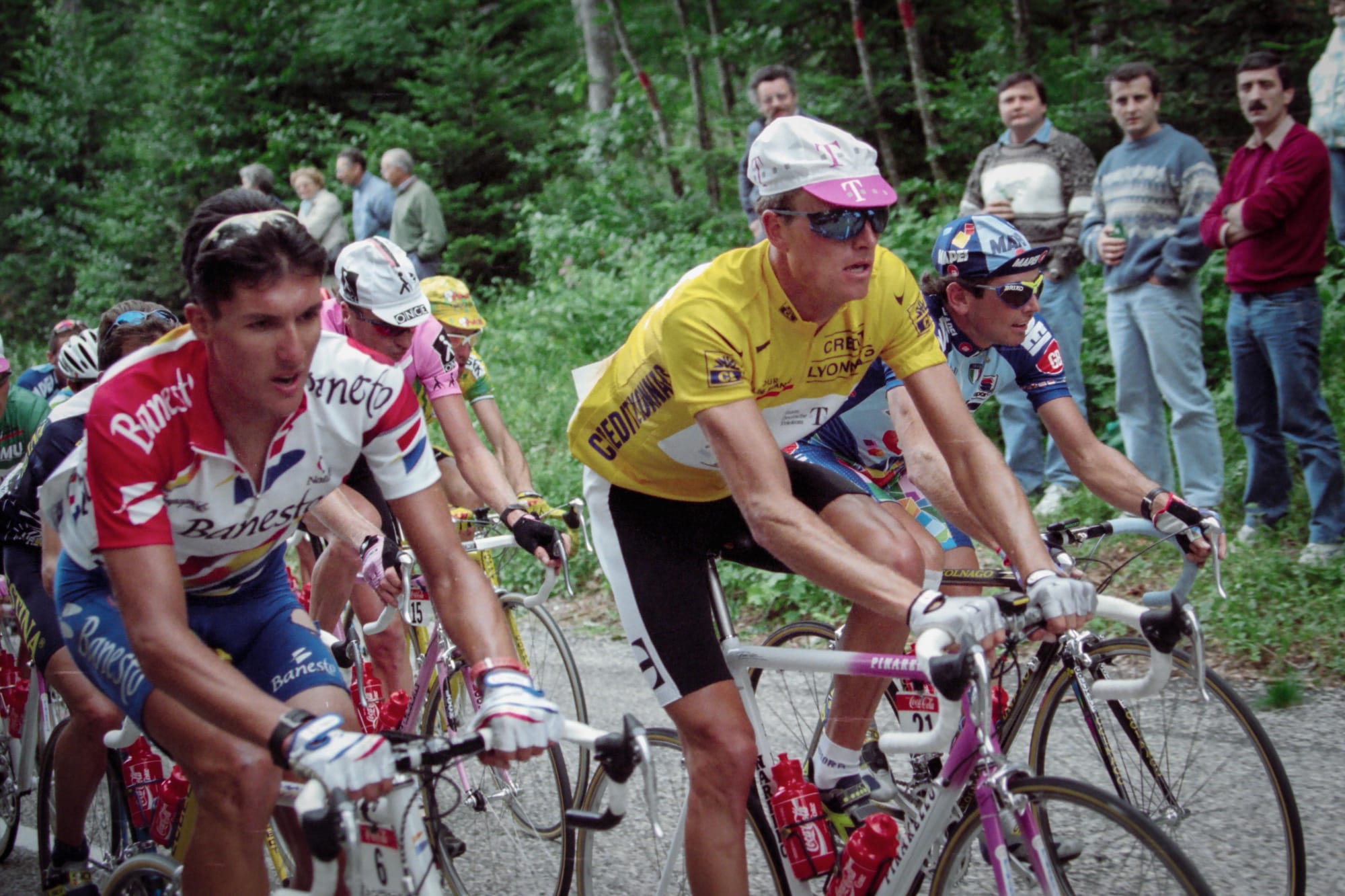 Riis climbing next to Indurain's teammate, José María Jiménez.