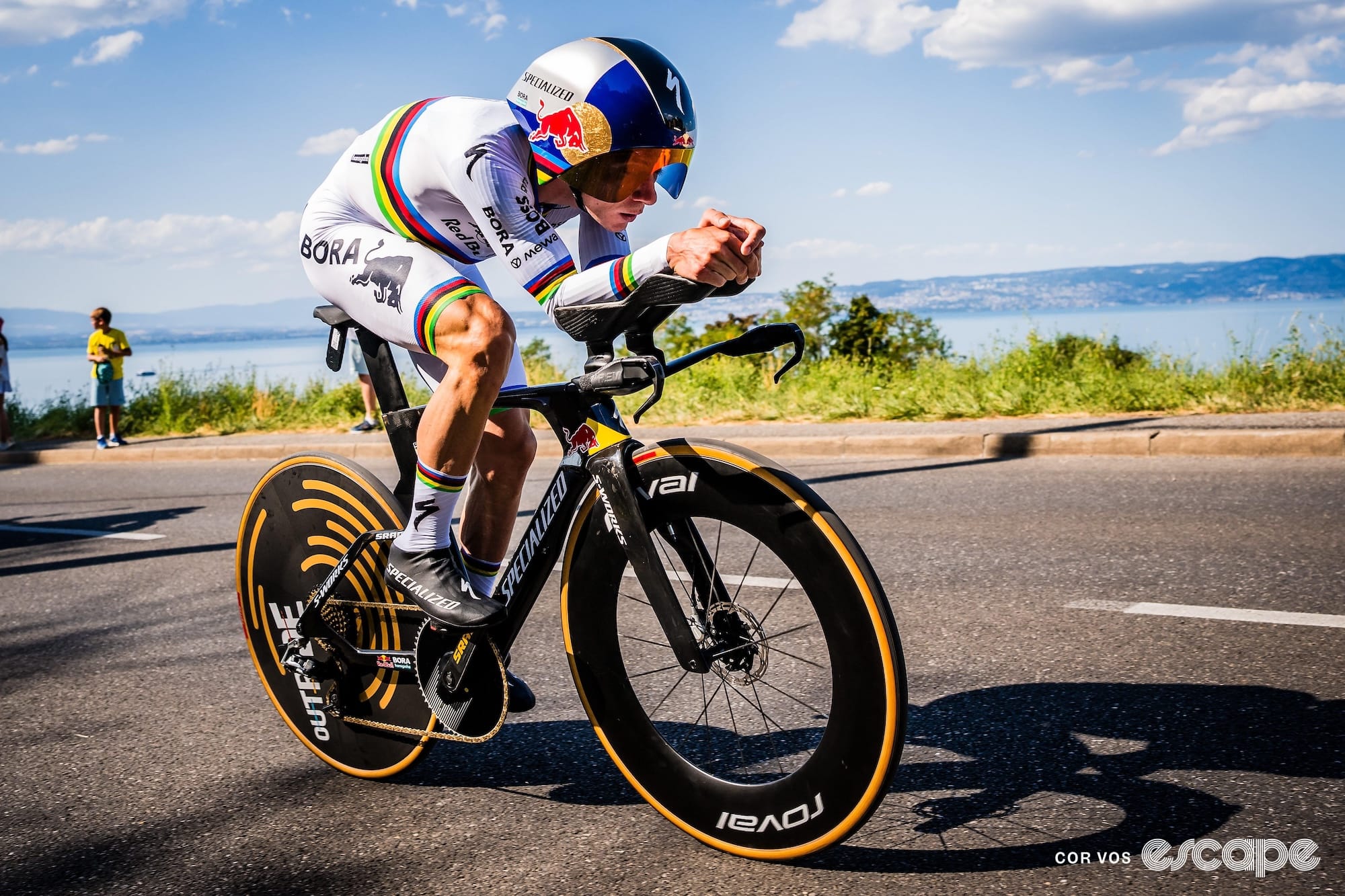 Remco Evenepoel is pictured riding his TT bike in world champion kit during the stage 16 time tri