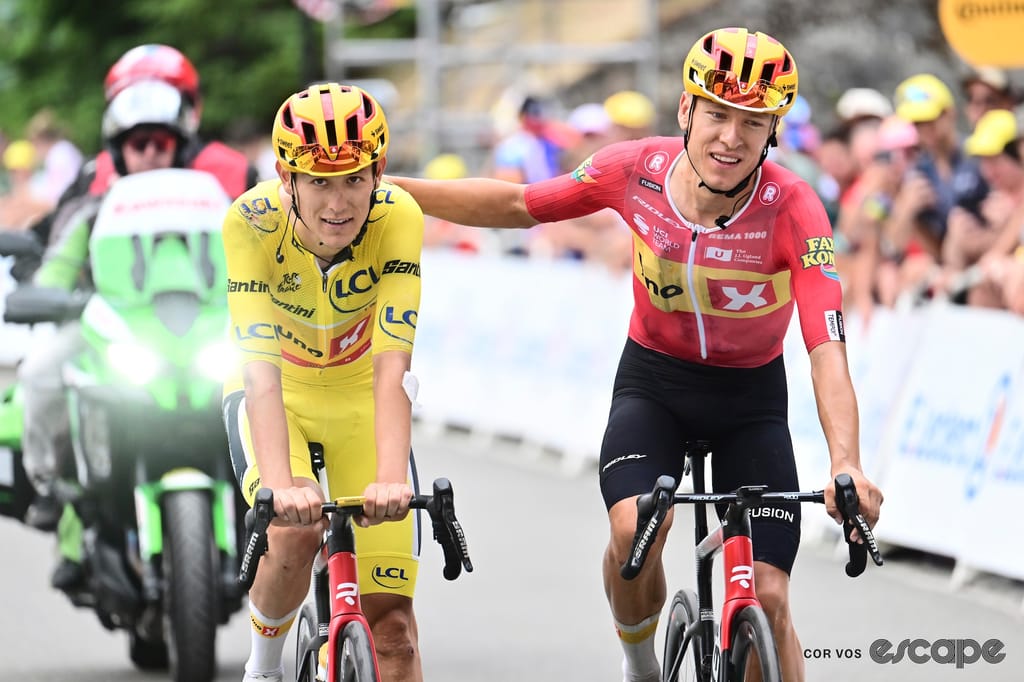 Johannessen pats Træen on the back as they arrive at the finish of stage 6. 