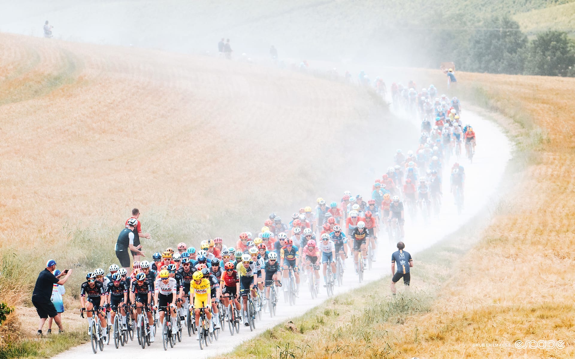 Fans delight as teams mop brows after surviving Tour's gravel spectacular