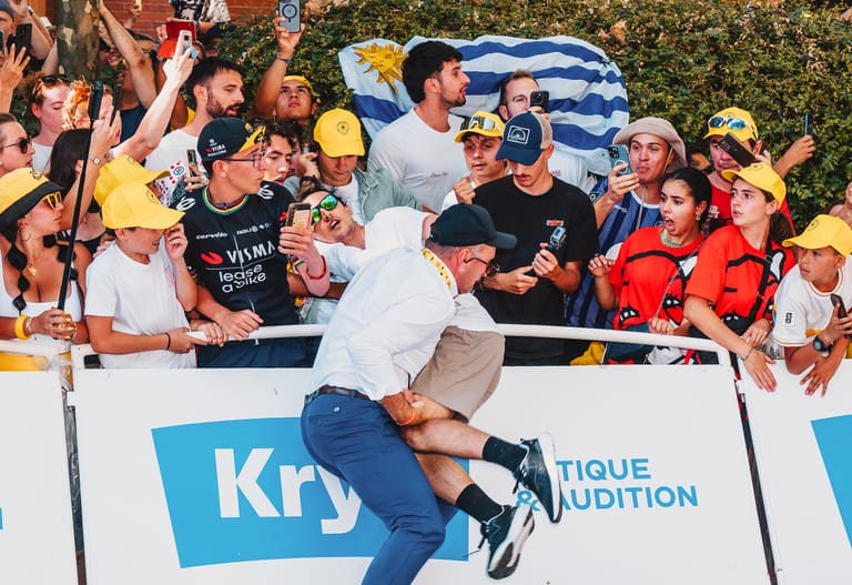 In photos: How a Tour de France executive rushed to remove protestor from finale