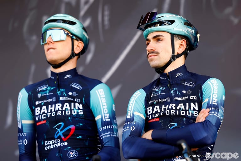 Lenny Martinez and an unnamed teammate stand on the stage at sign-in for the 2026 Brabantse Pijl race.
