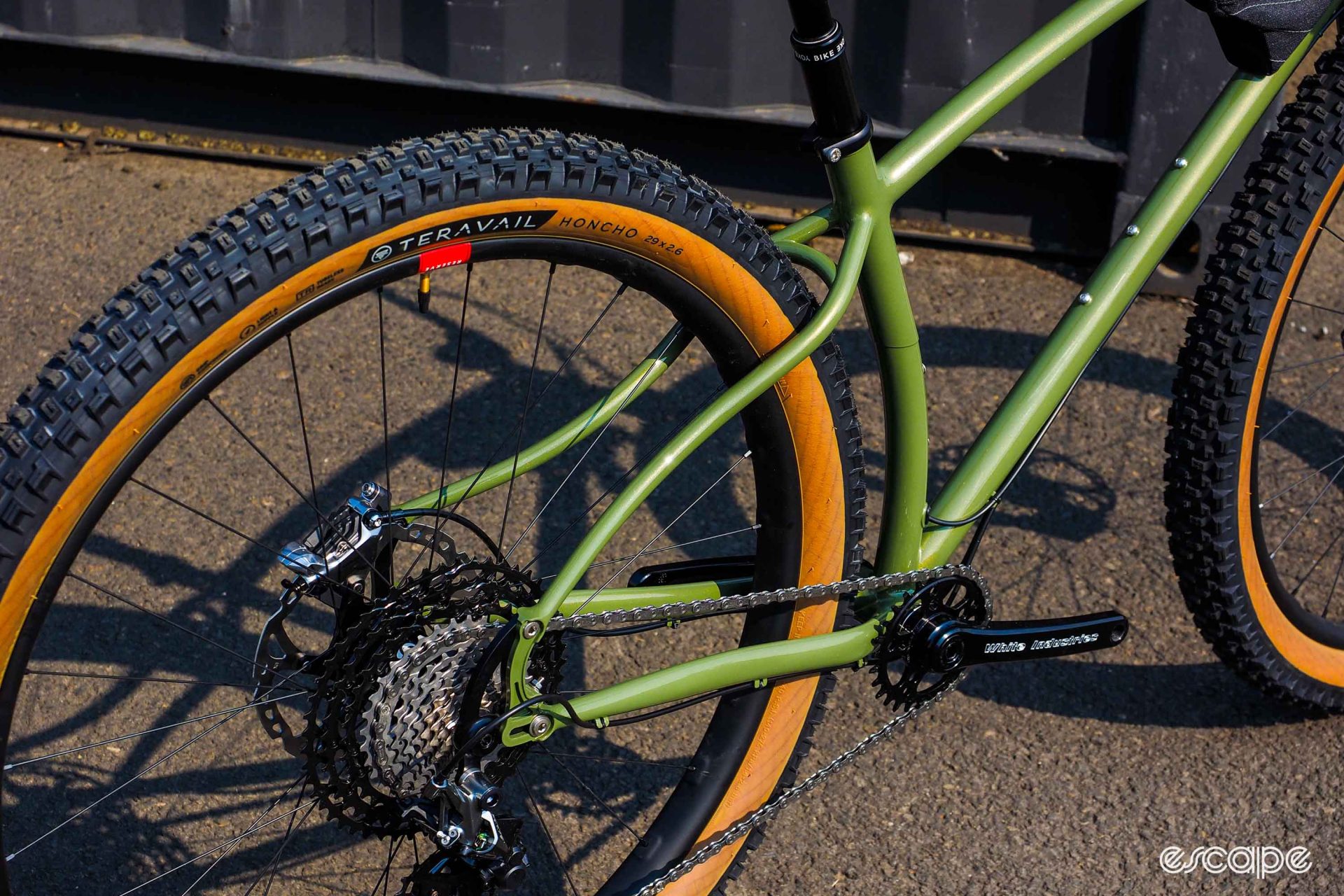 Ultra-swoopy seatstays on a green Black Cat 29er steel hardtail.