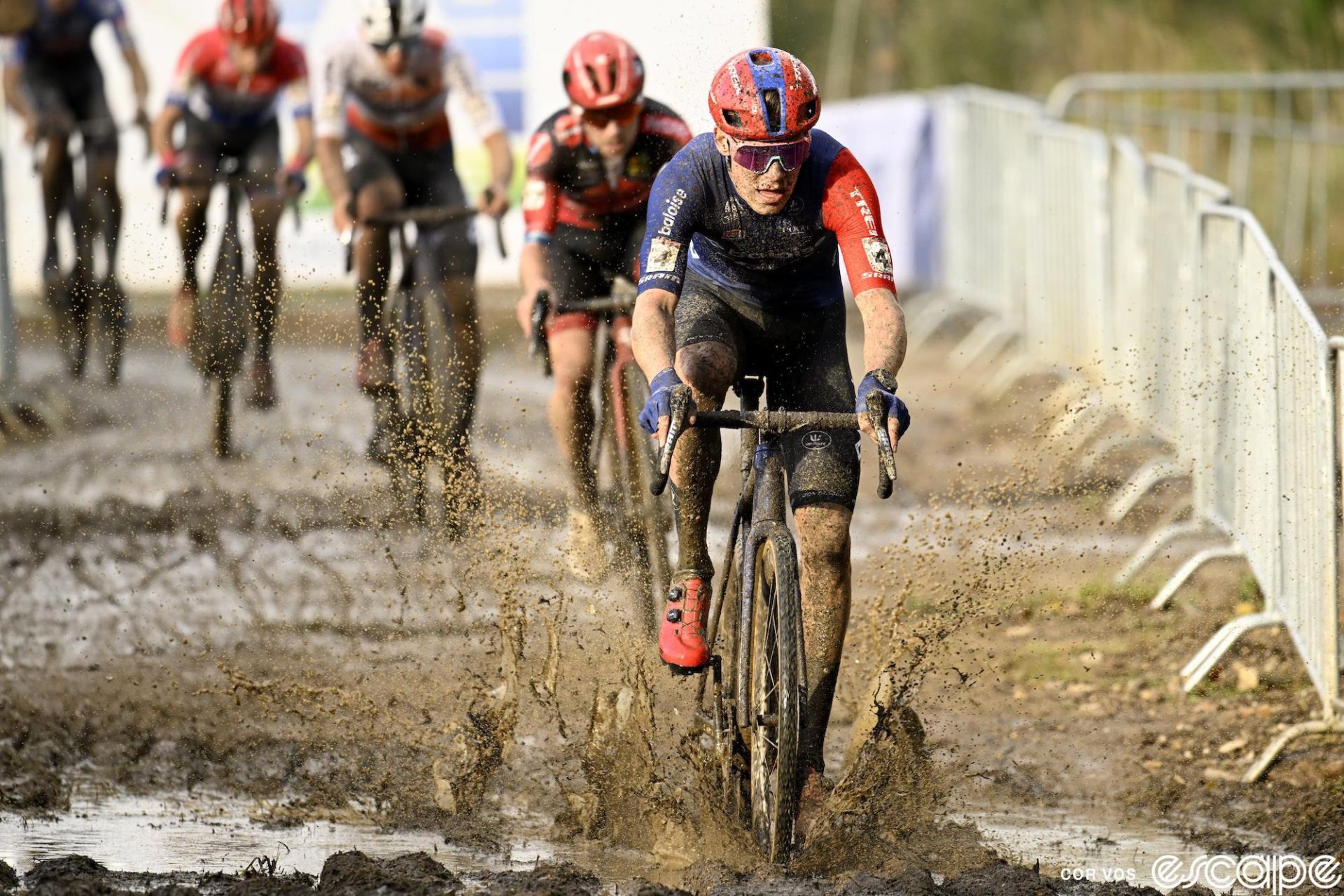 Pim Ronhaar leads a line of riders through soupy mud at Maasmechelen.