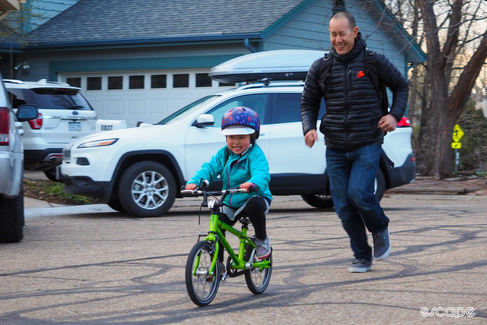 Kid learning to ride a bike on an Islabikes Cnoc 14