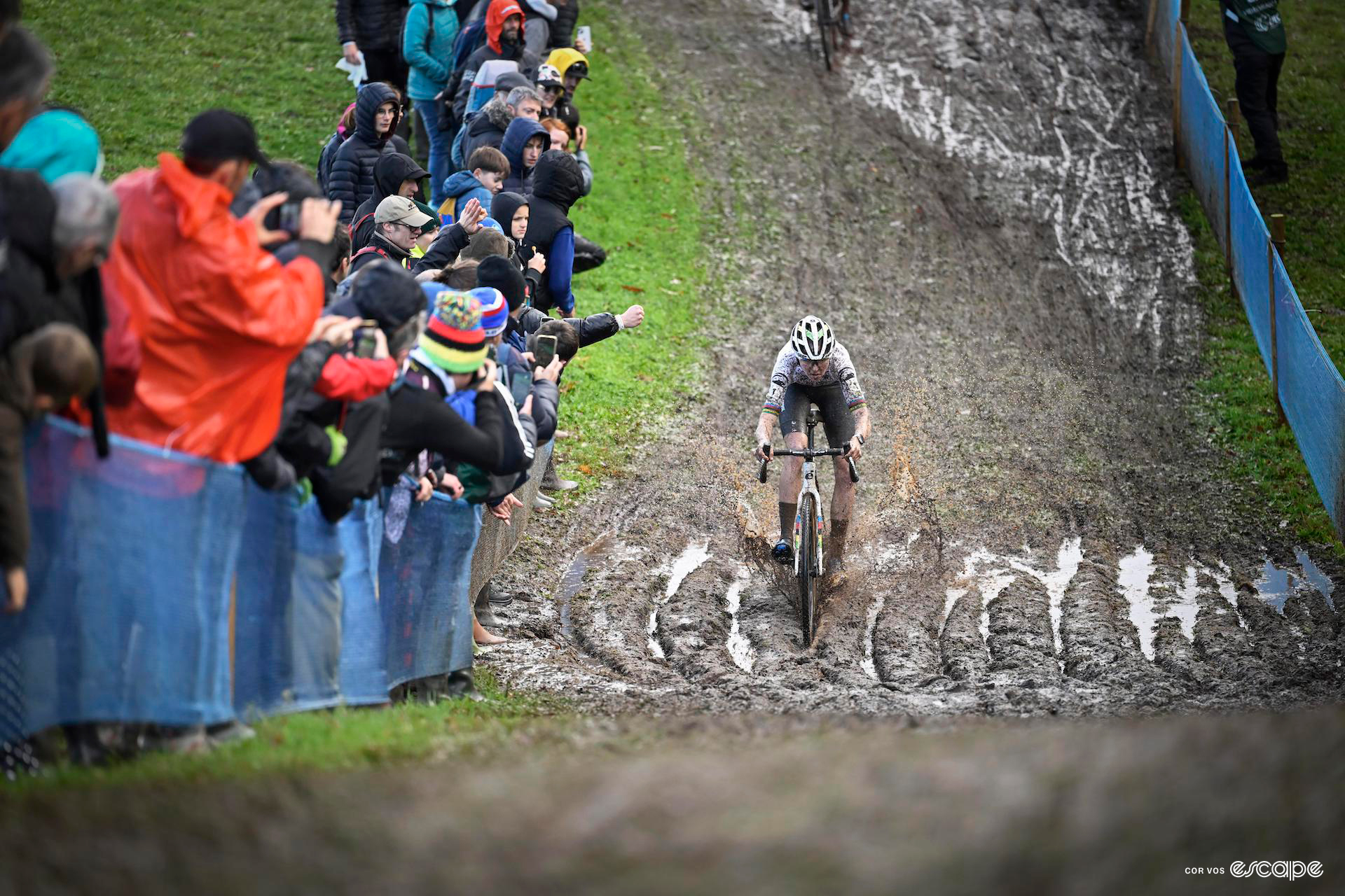 Fem van Empel rides solo through deeply rutted mud during the european champs.