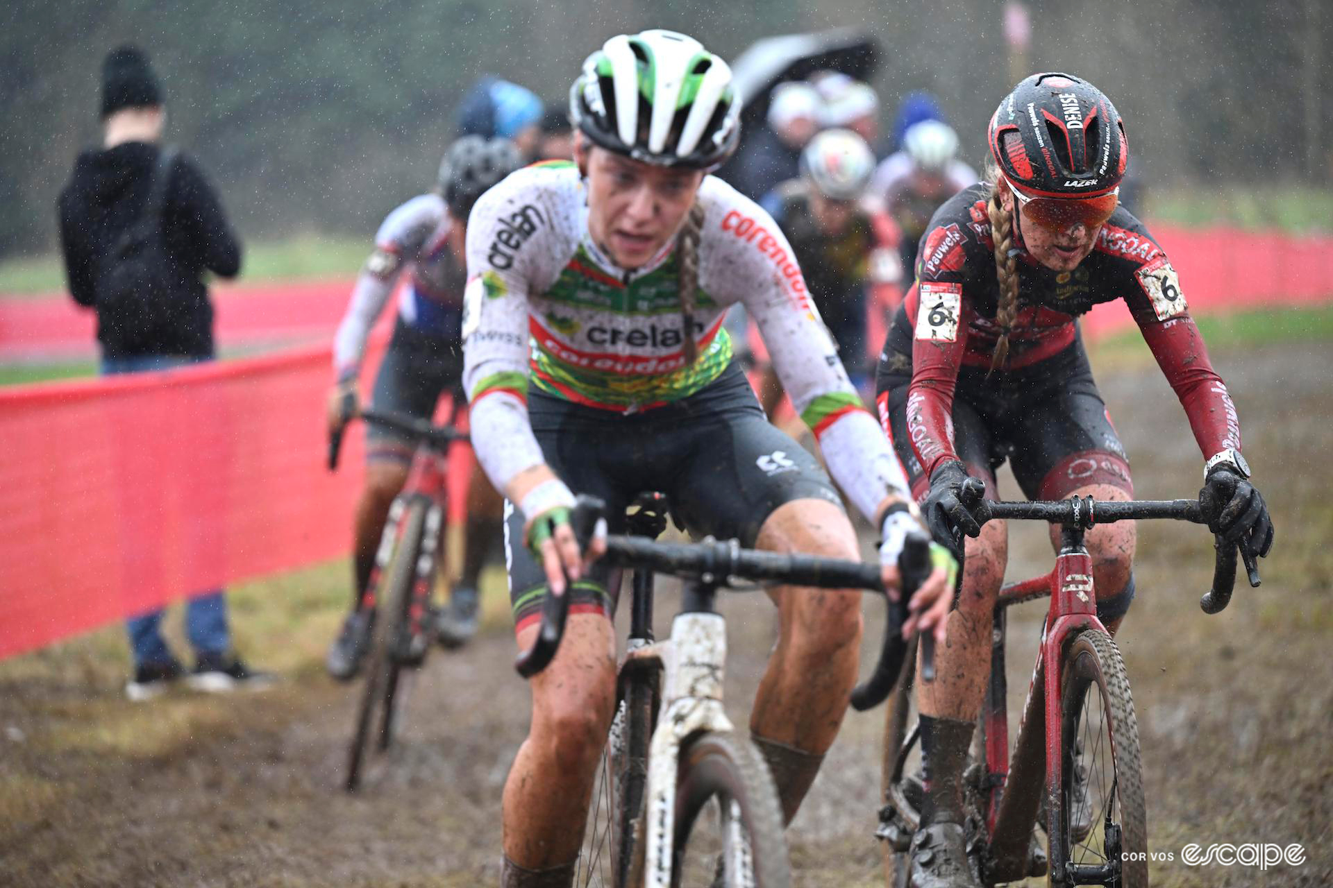 Inge van der Heijden rides ahead of Denise Betsema as rain falls on the muddy course at CX World Cup Dublin.