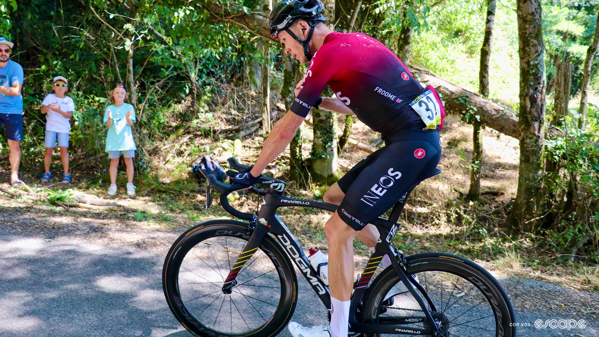 The photo shows Chris Froome climbing on a Pinarello F12