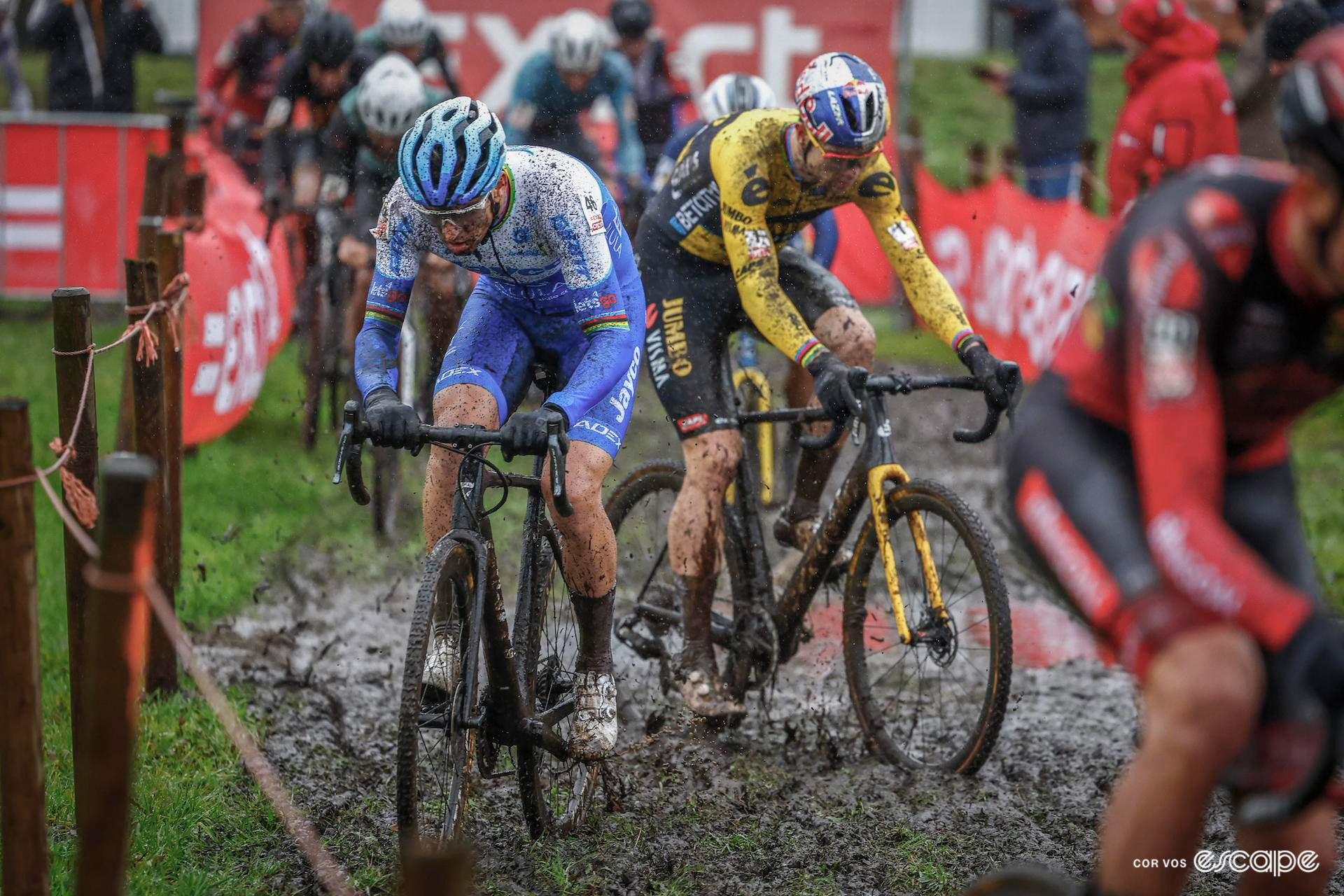 Zdenek Stybar and Wout van Aert during a very wet and muddy Exact Cross Essen.