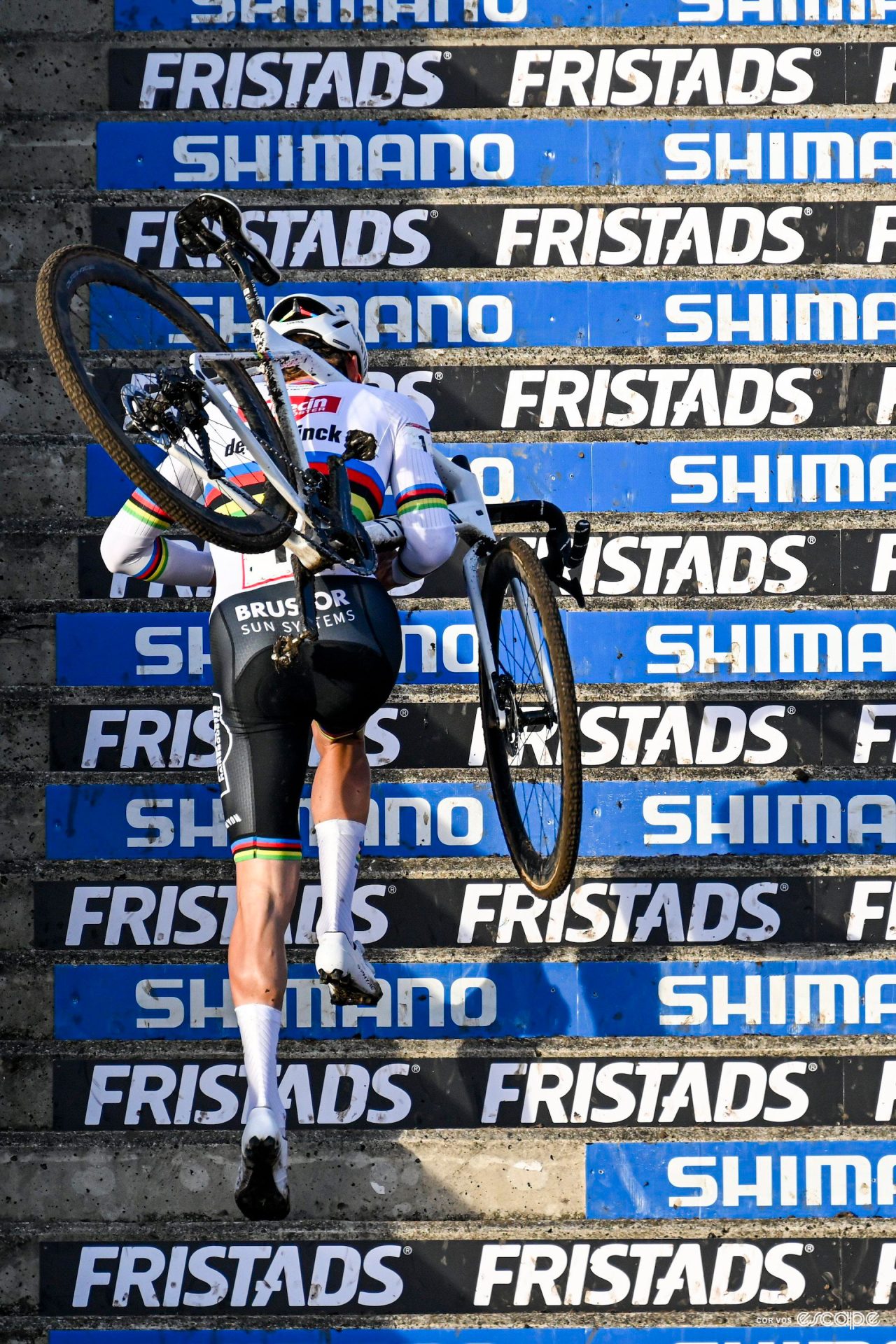 World champion Mathieu van der Poel runs up the stairs during CX World Cup Hoogerheide.