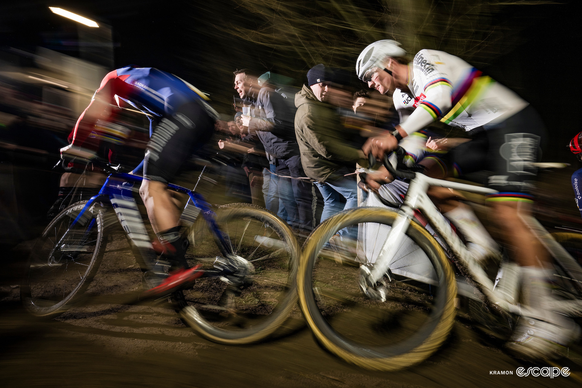 Joris Nieuwenhuis and world champion Mathieu van der Poel racing under floodlights at the nighttime Superprestige Diegem.