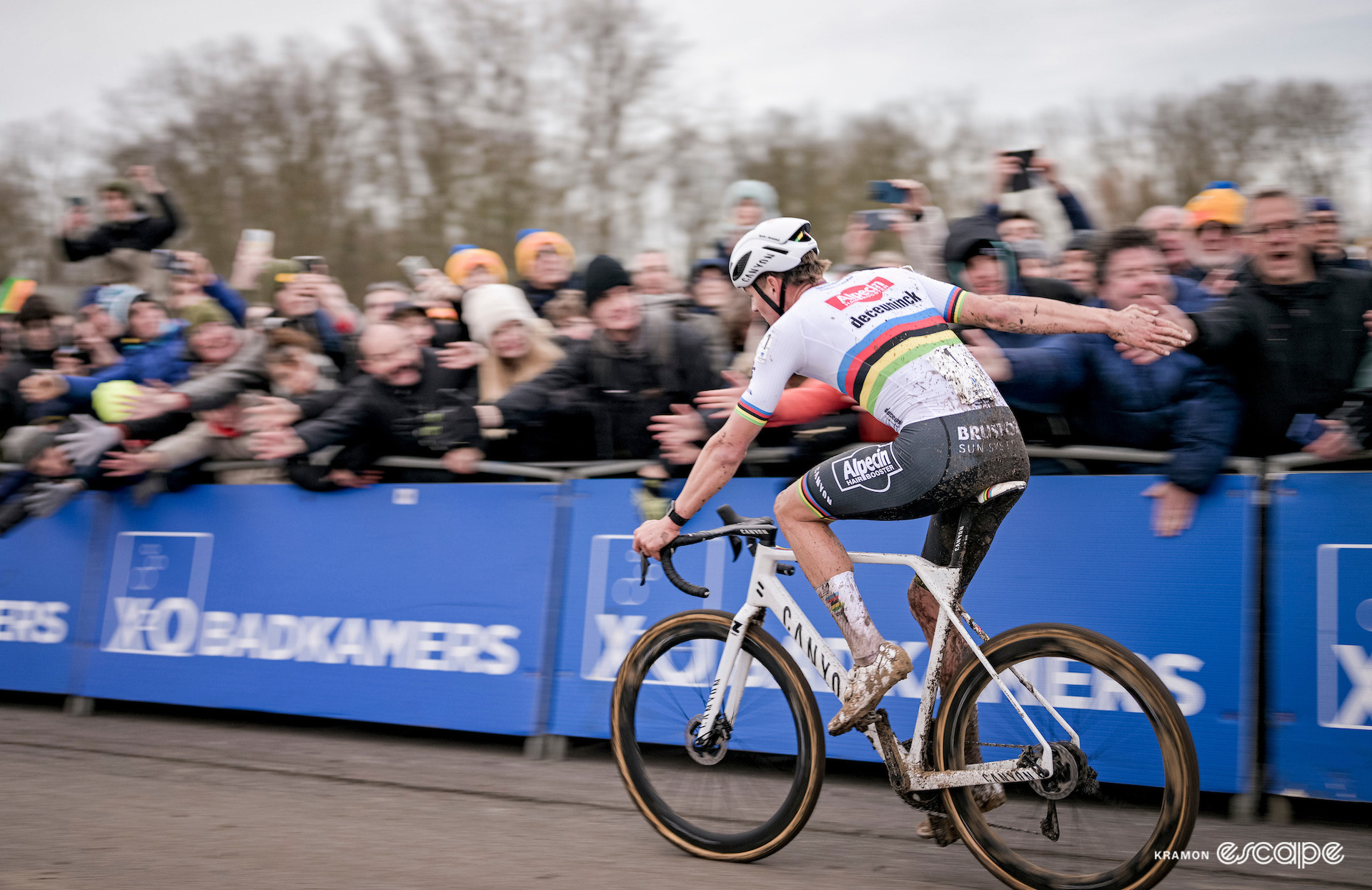 CX world champion Mathieu van der Poel accepts high-fives from the crowd as he wins X2O Trofee Koksijde - Vlaamse Duinencross.