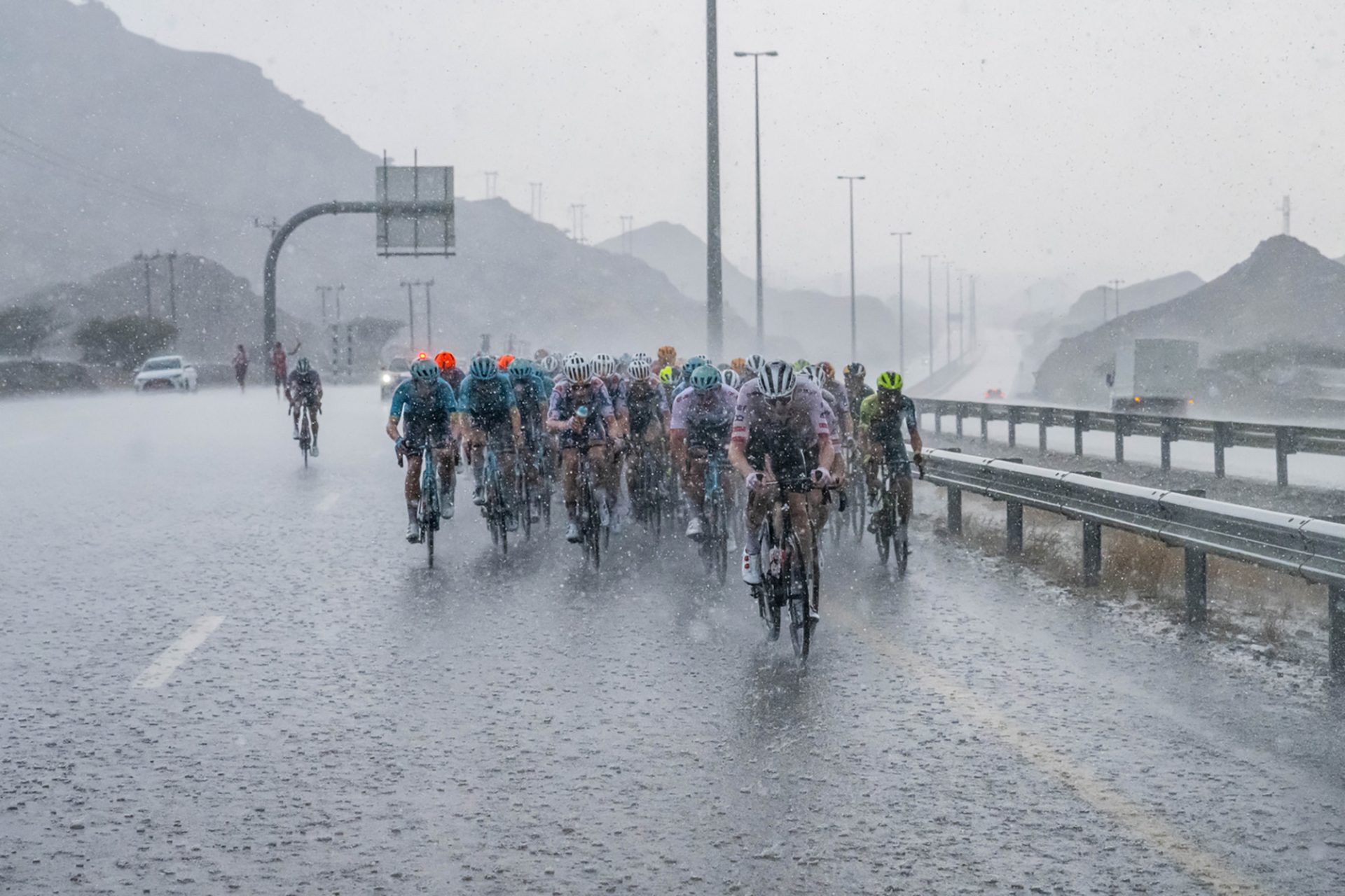 The riders battle the conditions.