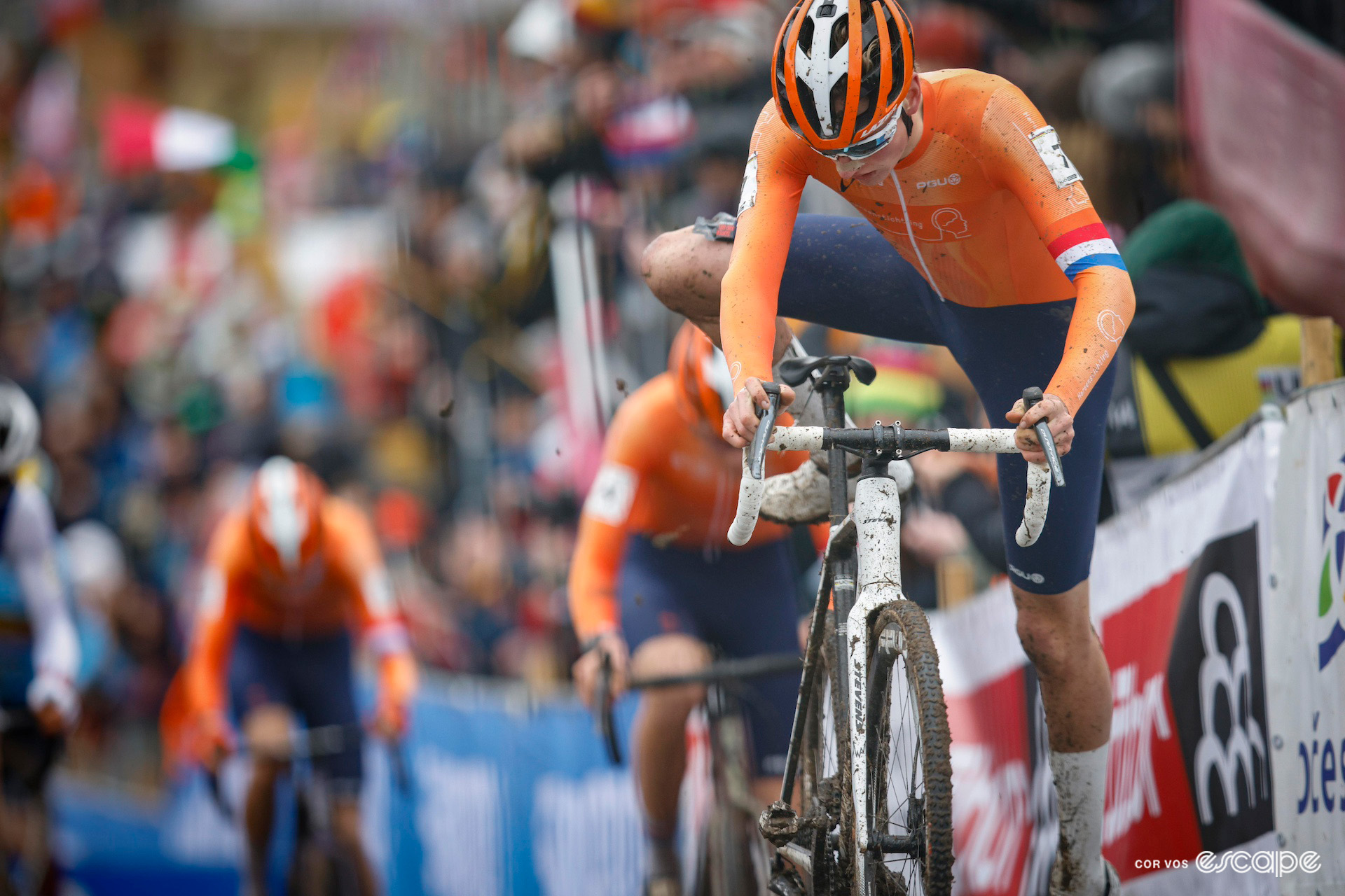 Dutch junior rider Keije Solen remounts his bike ahead of two of his compatriots during the 2024 Cyclocross World Championships in Tábor.