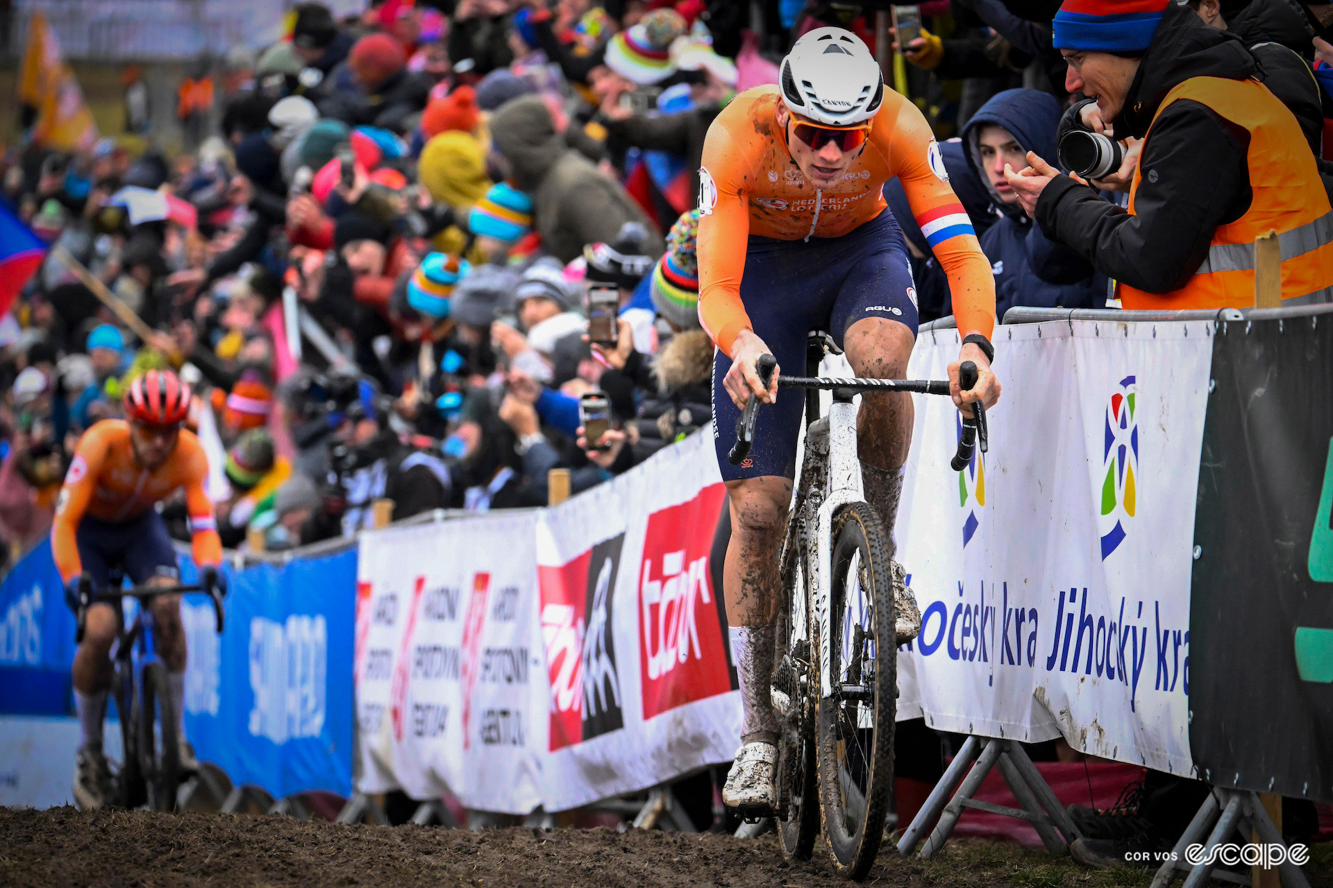 Dutch rider Mathieu van der Poel during the 2024 Cyclocross World Championships in Tábor, his compatriot Joris Nieuwenhuis chasing in the background.