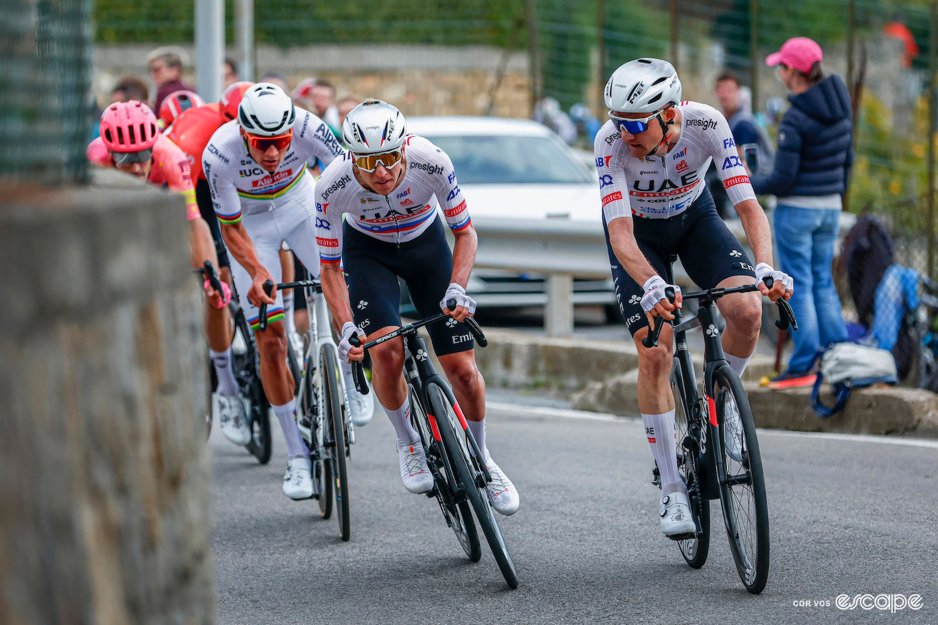 Tim Wellens moves over as Tadej Pogačar attacks on the Poggio during Milan-San Remo 2024.