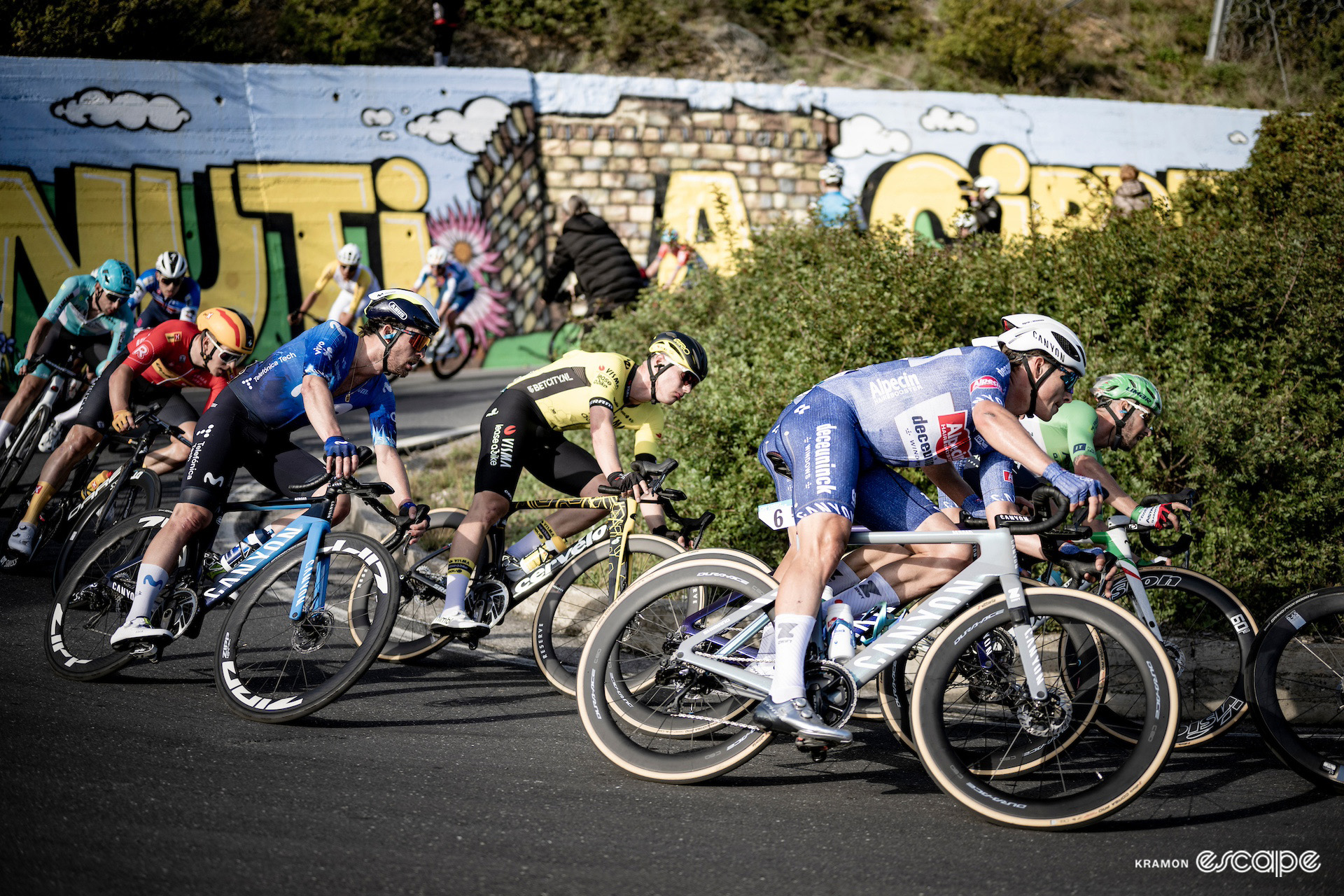 Jasper Philipsen descending the Cipressa in the bunch during Milan-San Remo 2024.