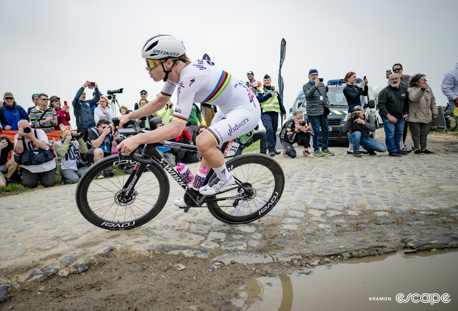 Kopecky takes a muddy corner in all white