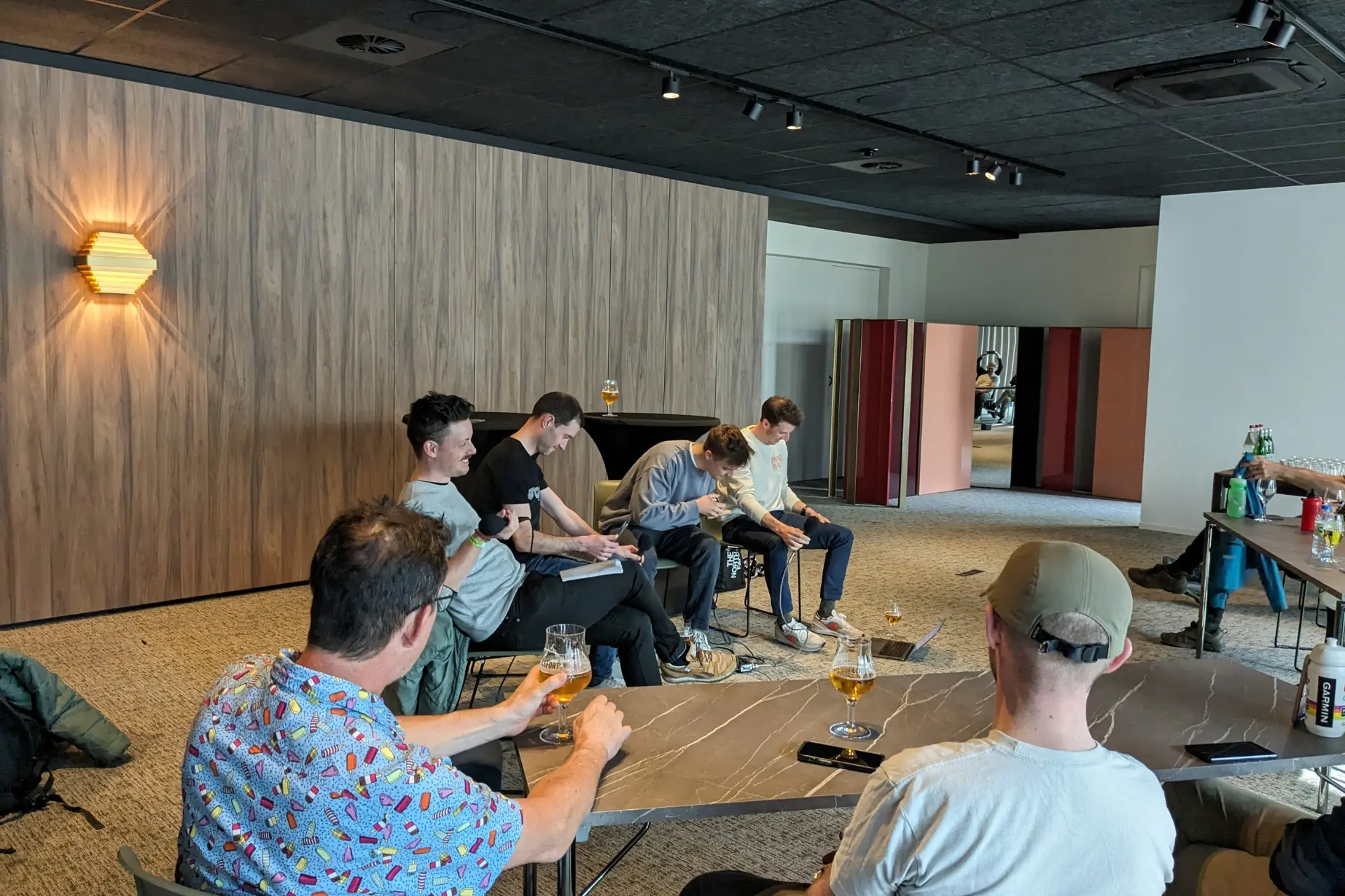 Ronan, Caley, Jonny and Iain hosting a live recording of a podcast in the conference room of Parkhotel Kortrijk