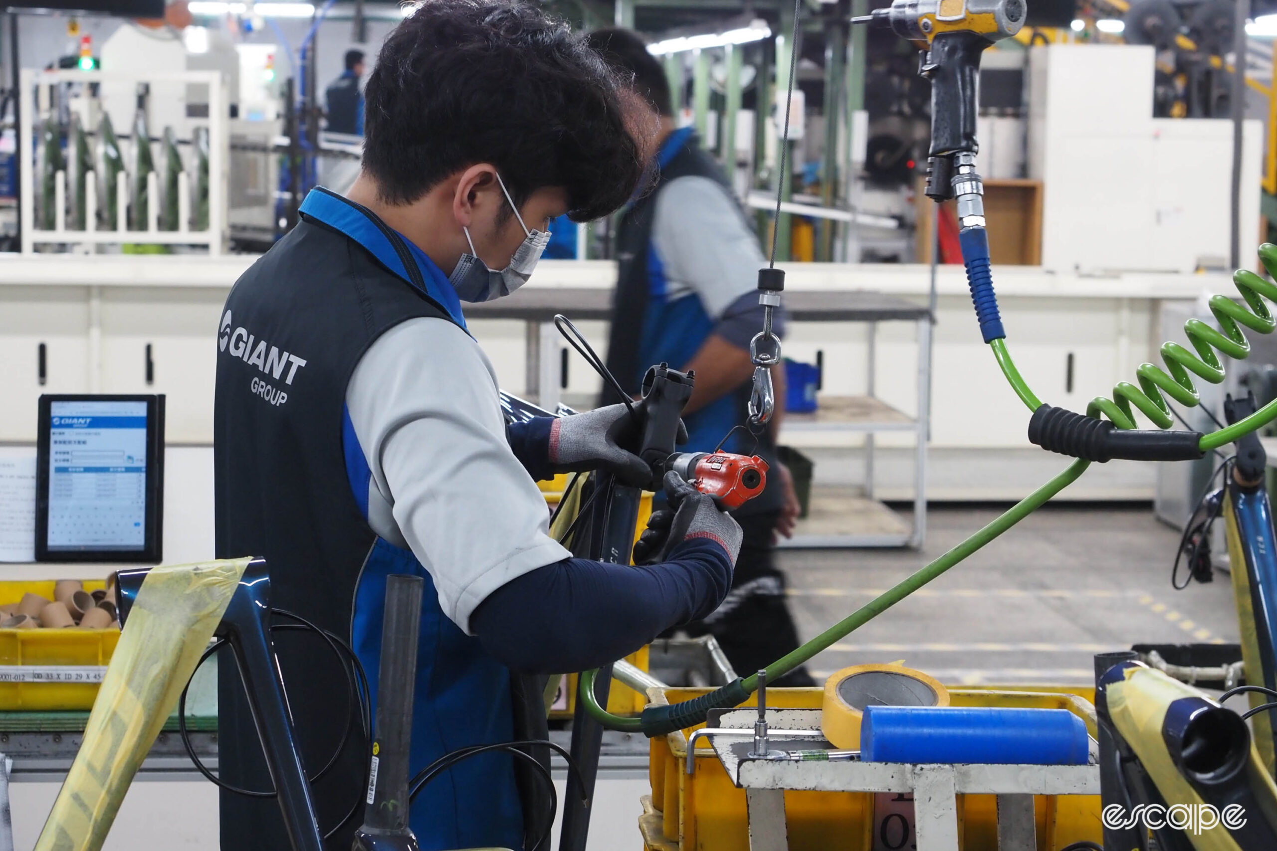 Giant carbon factory tour installing stem