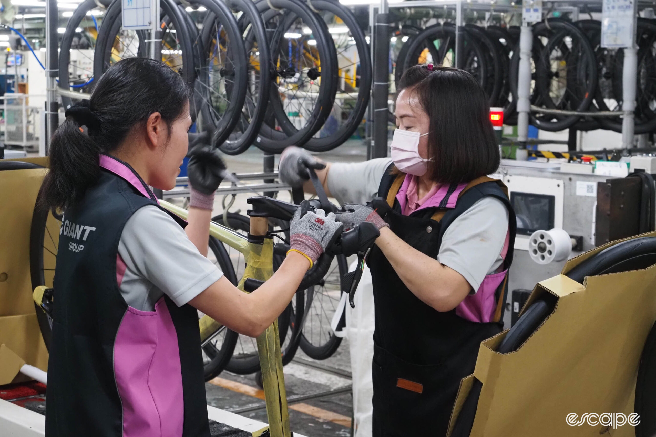 Giant carbon factory tour installing handlebar tape