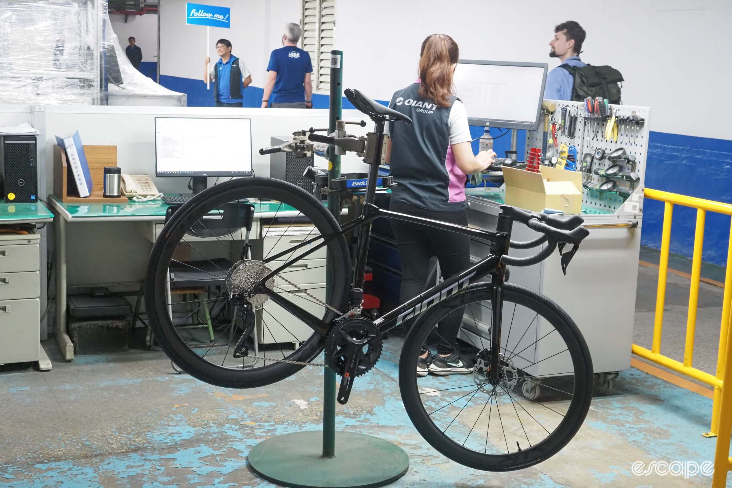 Giant carbon factory tour bike being inspected