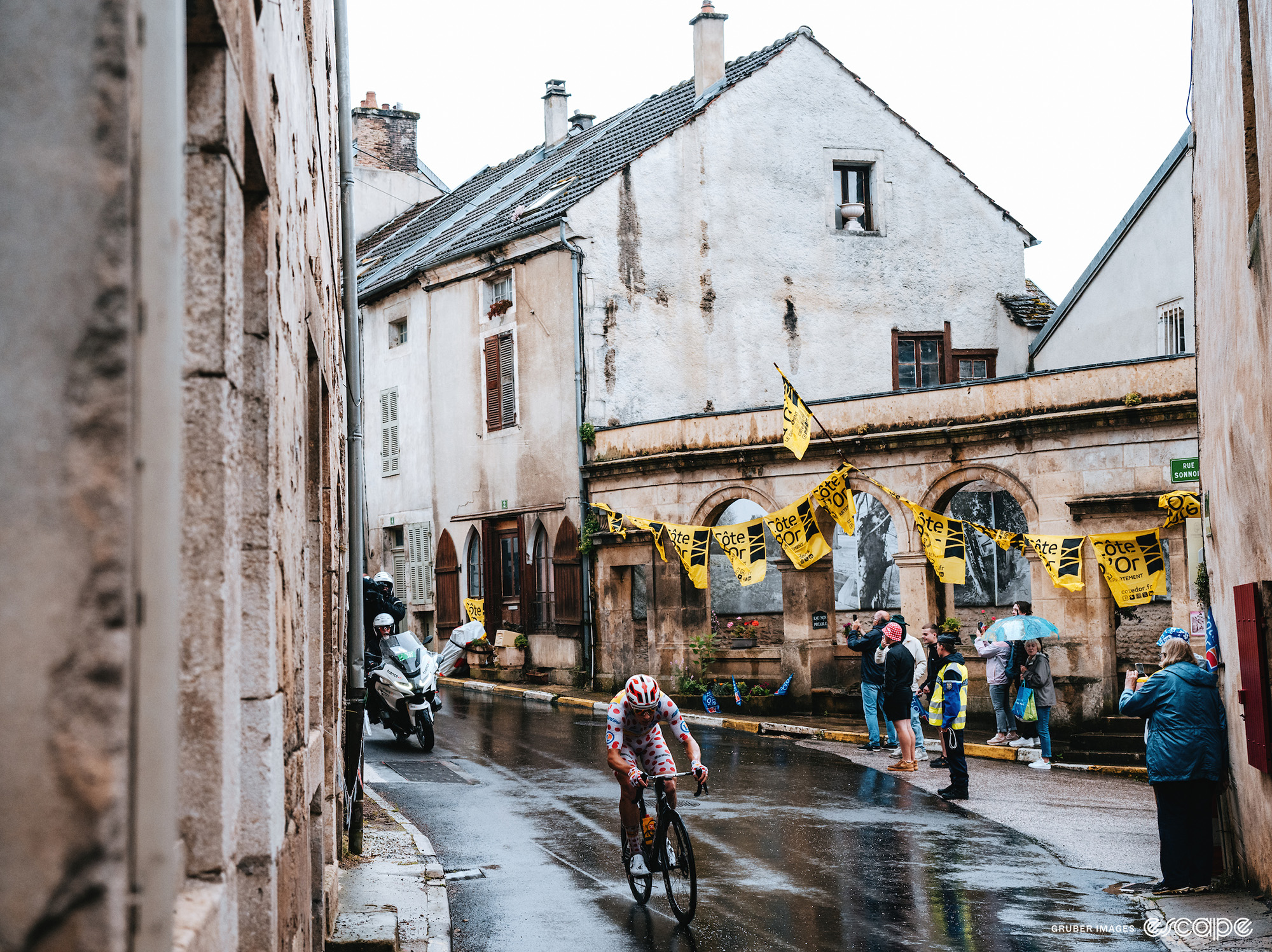 Jonas Abrahamsen riding in the rain on his lonesome.