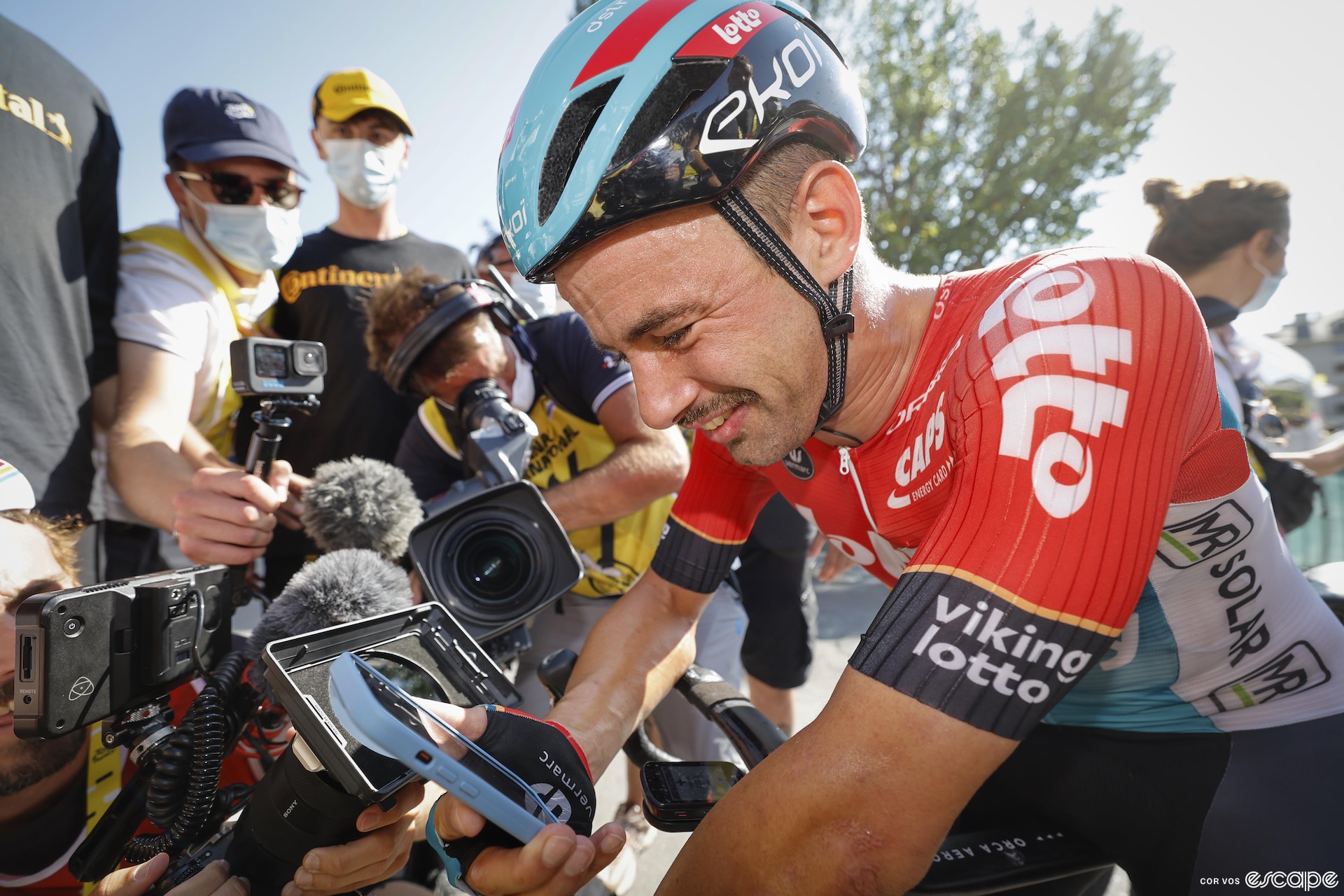 Victor Campenaerts talks to his family after winning stage 18 of the Tour de France.