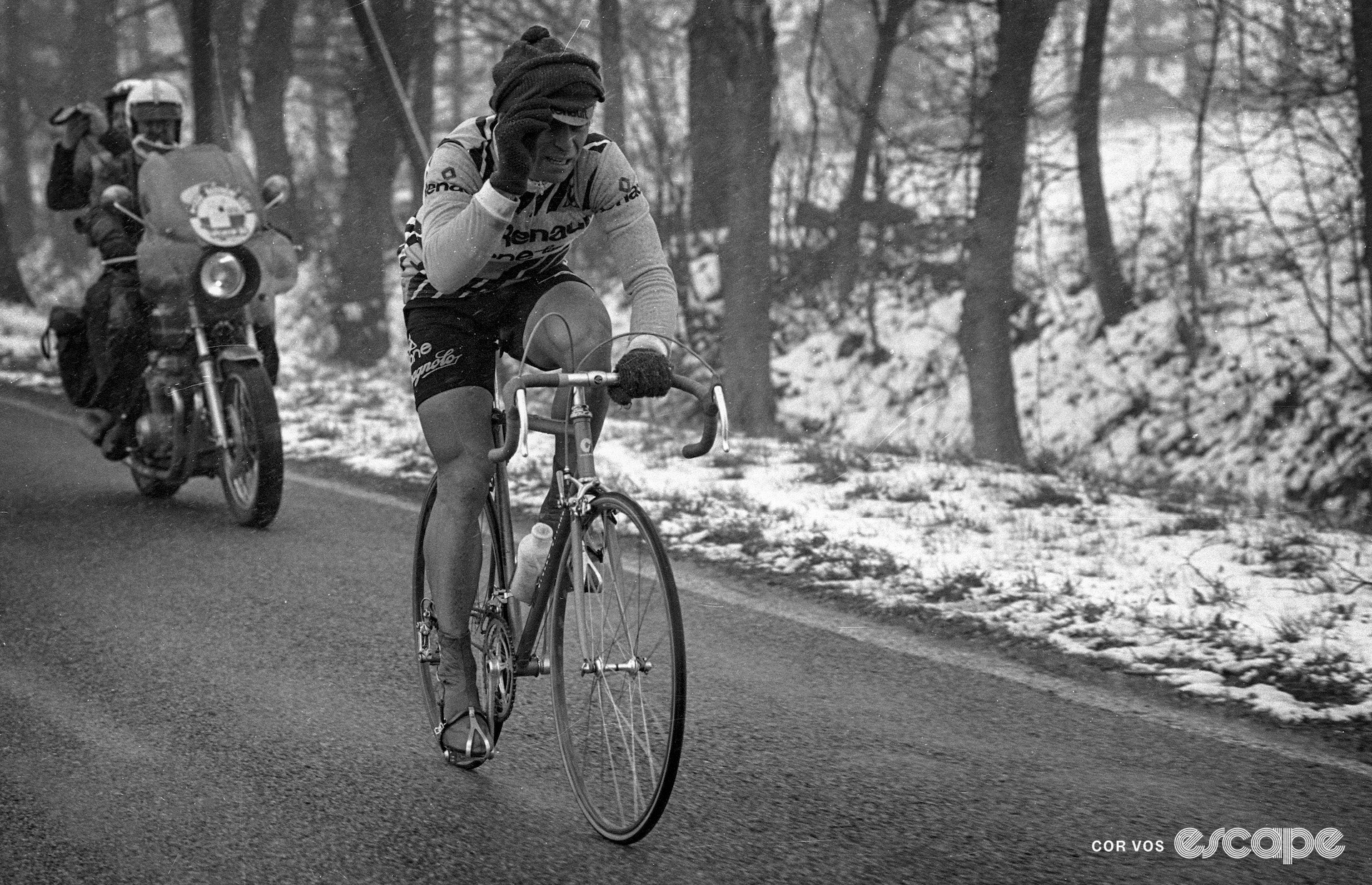 Bernard Hinault adjusting a woollen hat during a wintery 1980 Liège-Bastogne-Liège.