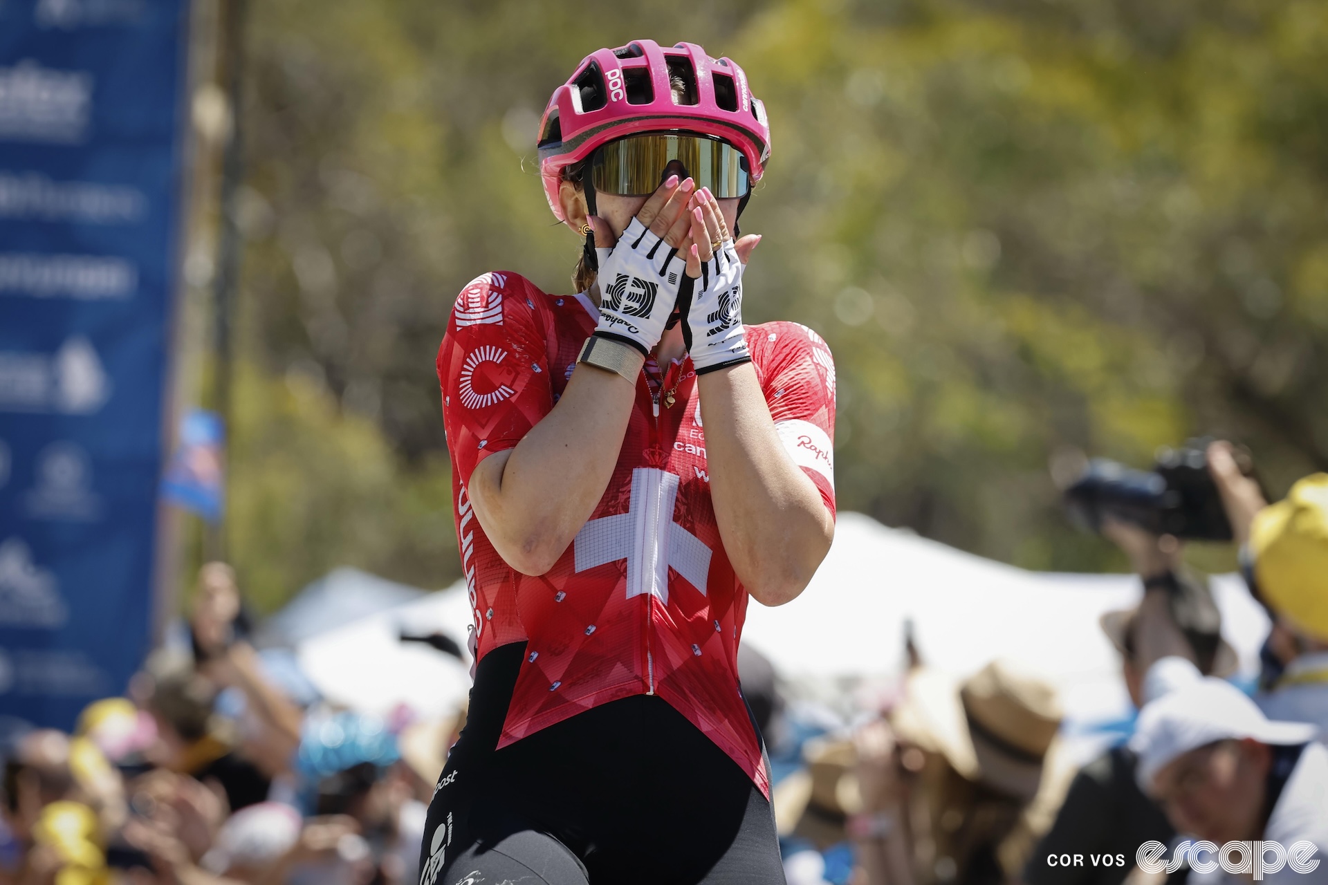 Noemi Ruegg holds her hands over her mouth in disbelief