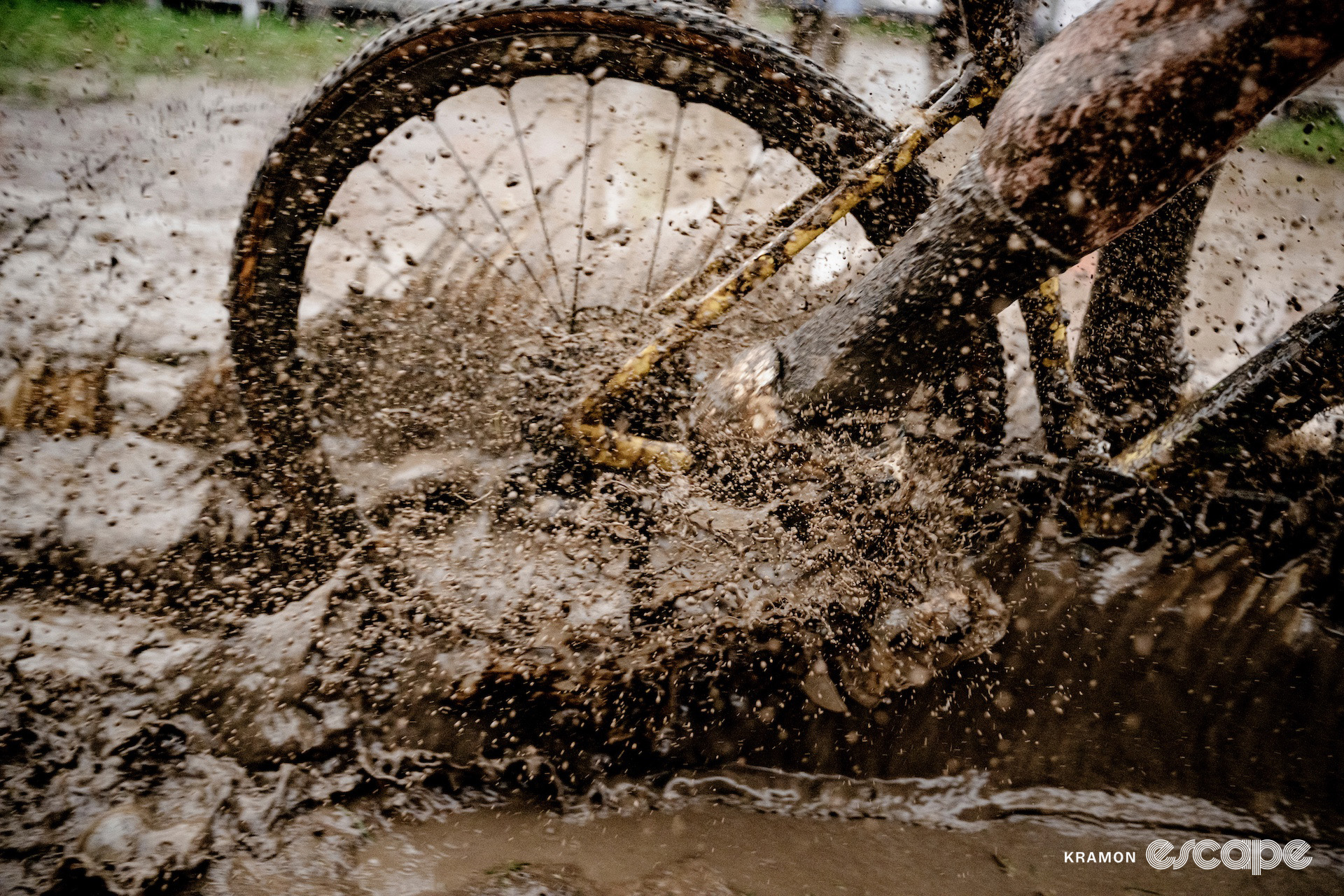 Detail of Wout van Aert's bike splashing through thick wet mud during World Cup Dendermonde.