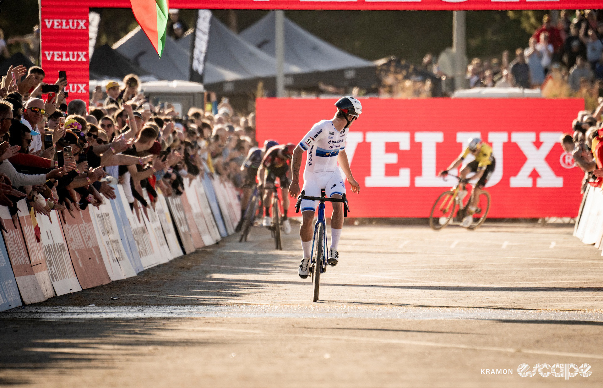 Thibau Nys looks over his shoulder at the chasing riders in the finishing straight on his way to winning cyclocross World Cup Benidorm.