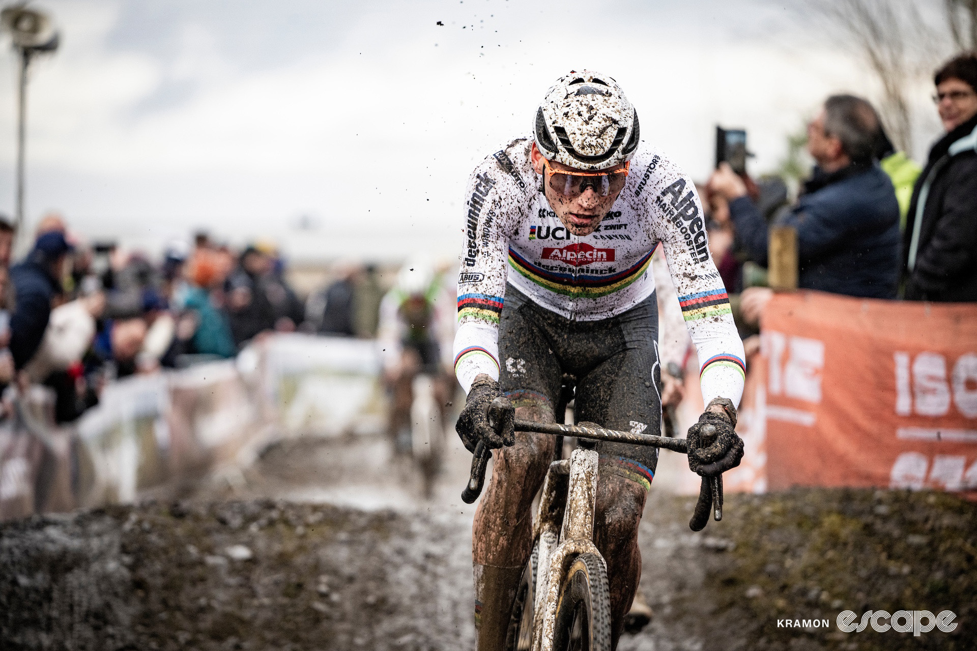 Mathieu van der Poel pictured fairly early in the race at cyclocross World Cup Maasmechelen, mud already covering his legs but his predominantly white world champion's jersey only sprinkled.