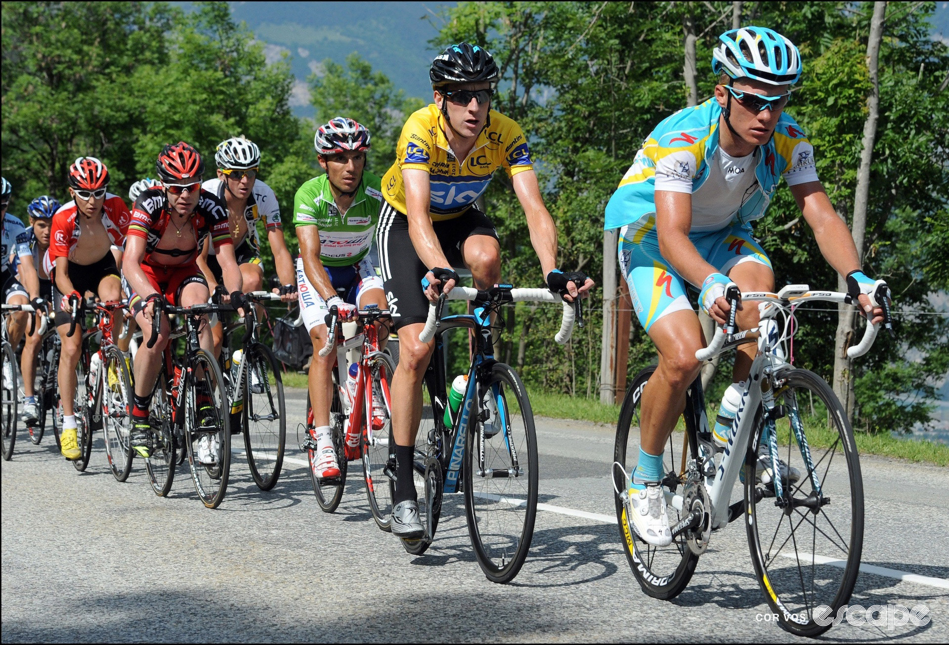 Astana's Alexandre Vinokourov leads yellow jersey-wearer Bradley Wiggins during the 2011 Critérium du Dauphiné.