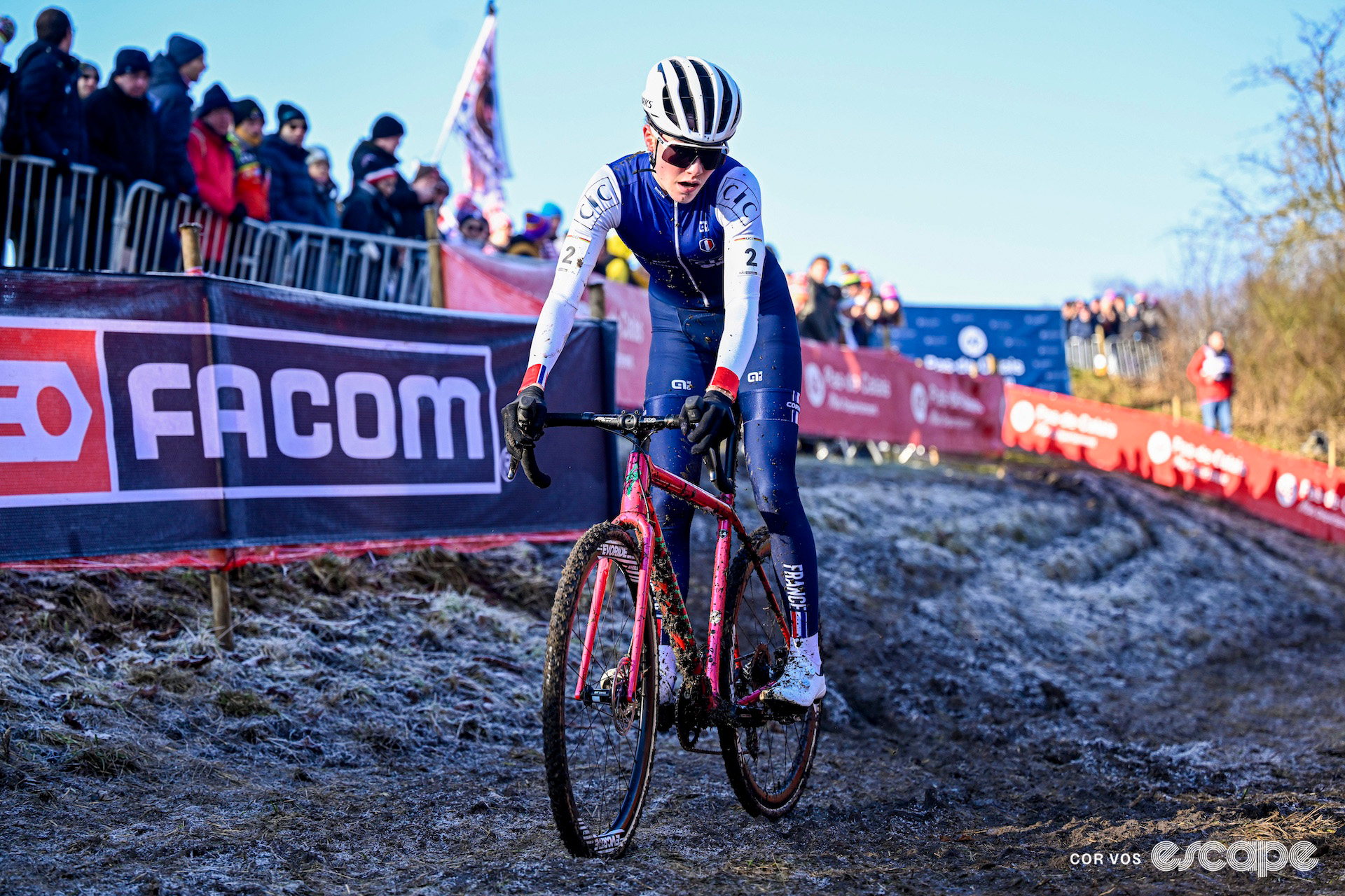 French rider Lise Revol rides over frozen mud during the 2025 junior women's cyclocross World Championships.