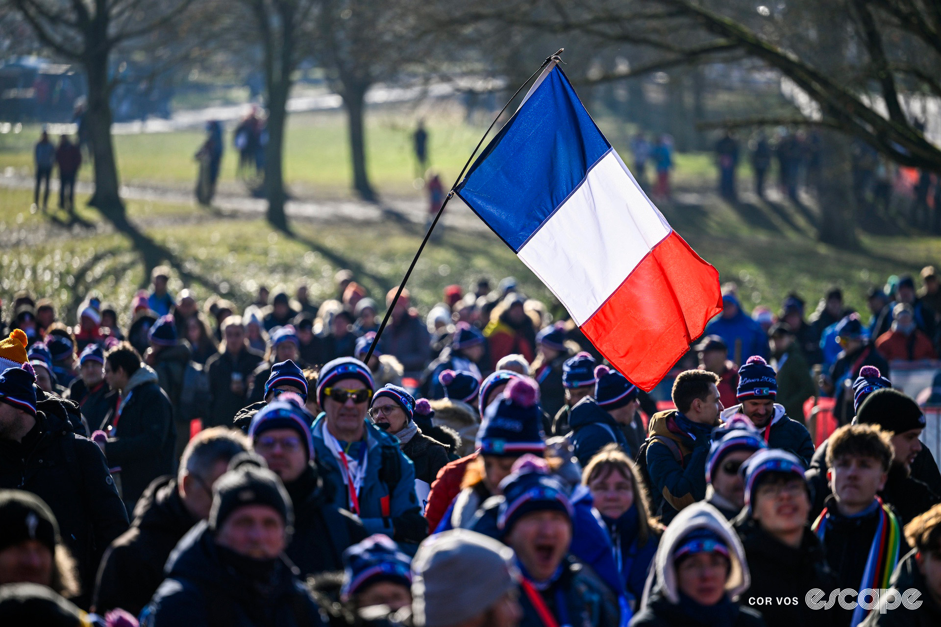 A fan flies a French tricolore during the 2025 cyclocross World Championships in Liévin, France.