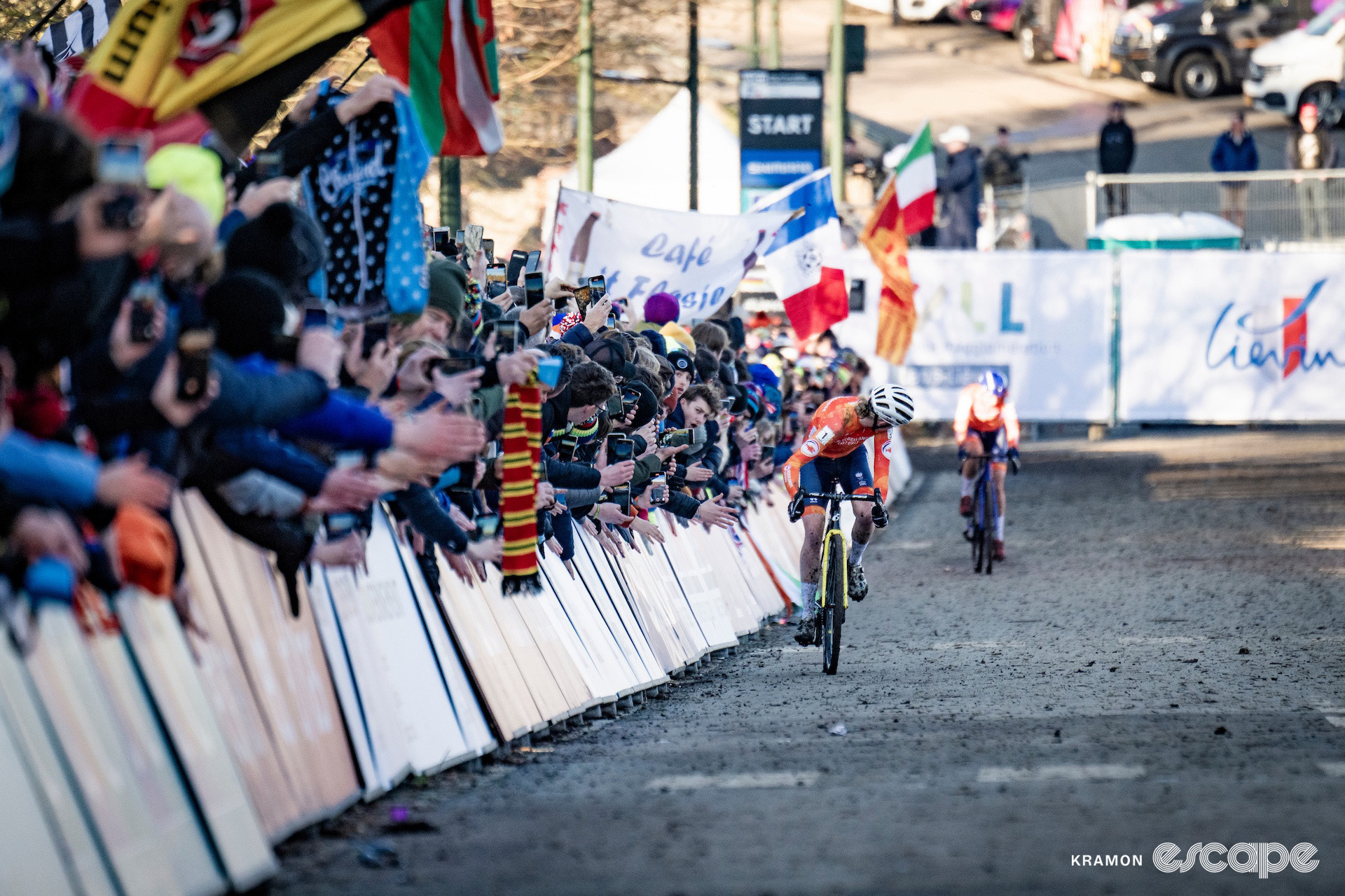 Fem van Empel looks over her shoulder to see Lucinda Brand in the background as she closes in on victory at the 2025 elite women's cyclocross World Championships.