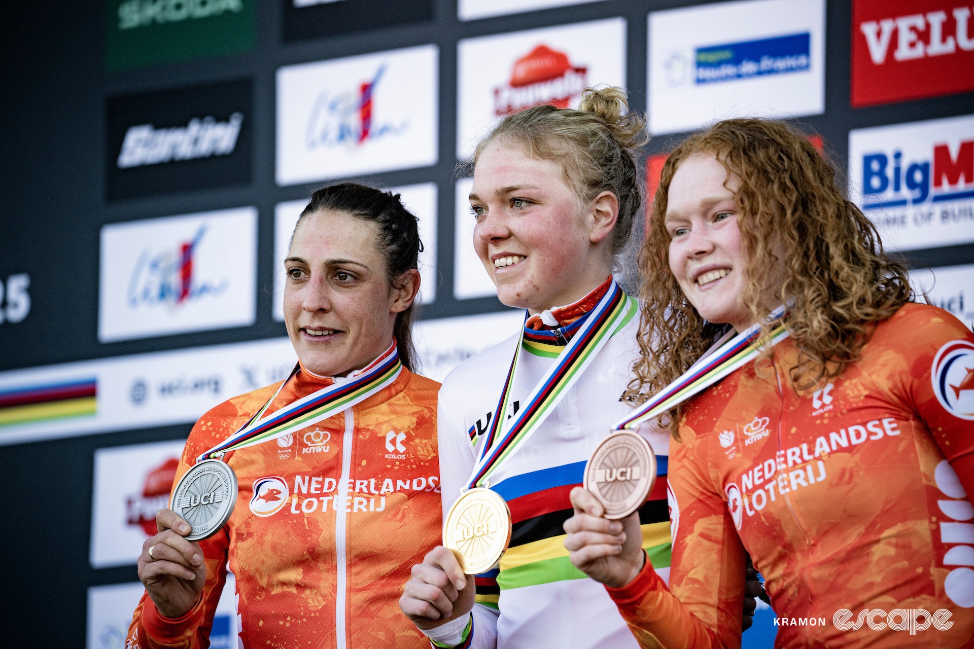 Lucinda Brand, winner Fem van Empel, and Puck Pieterse on the elite women's podium at the 2025 cyclocross World Championships.