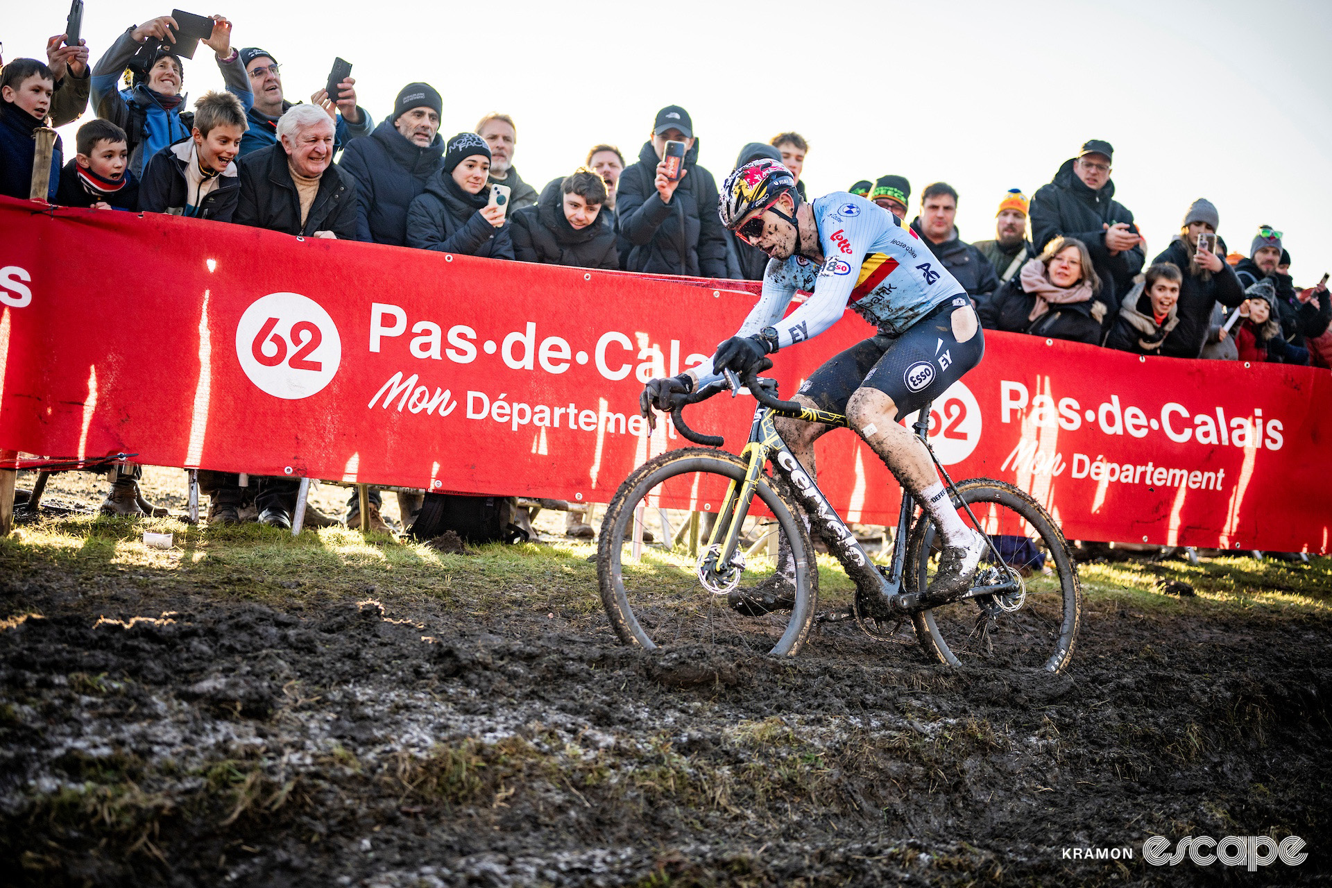 Belgium's Wout van Aert rides through rutted mud during the 2025 elite men's cyclocross World Championships.