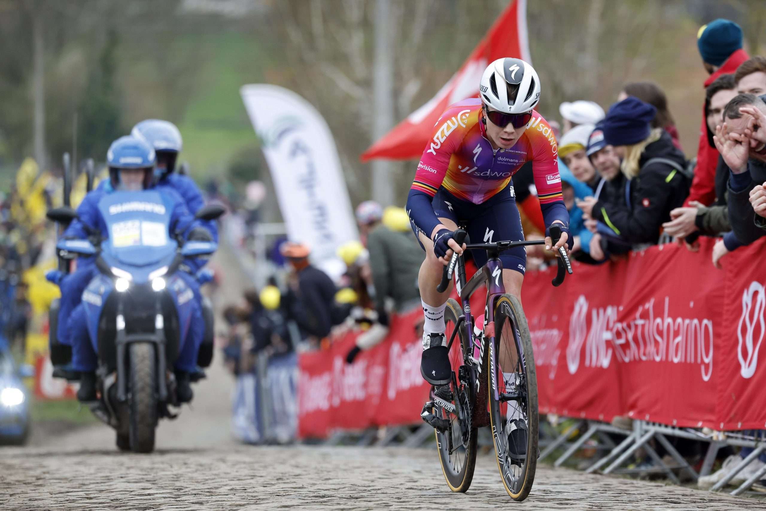 SD Worx's Lotte Kopecky accelerates on the Oude Kwaremont climb en route to a solo victory at the 2023 Women's Tour of Flanders.