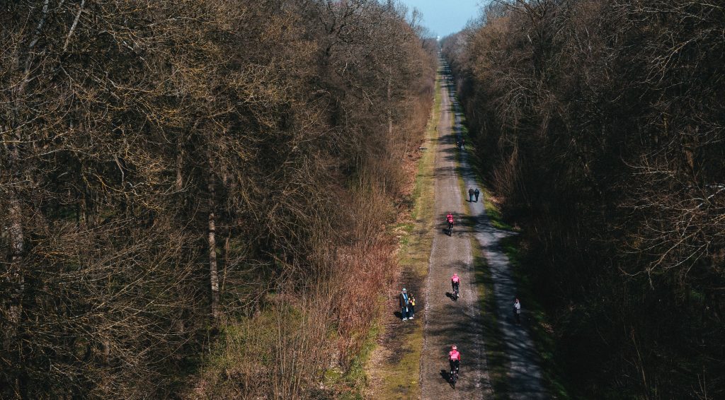 Three EF riders make their way down the famous Arenberg Forest section. Nicknamed the Trench, the sector is one of the few in the race that is not in open farmland. It is dead-straight, bisecting a thick forest where the World War I armistice was signed.