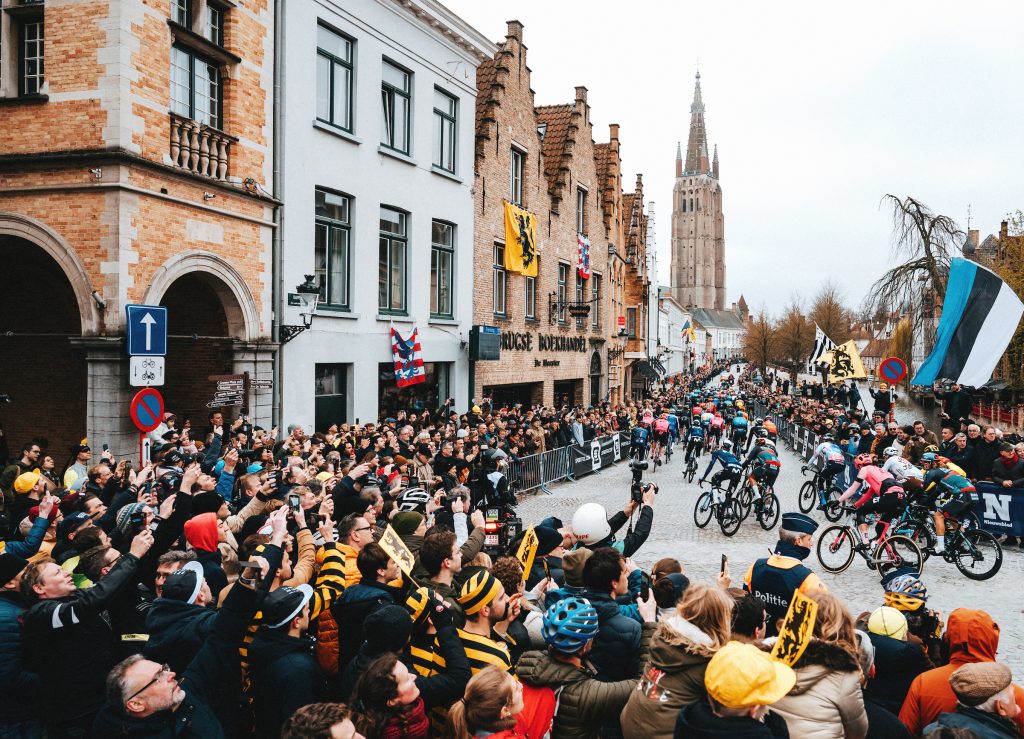The peloton rolls out of Bruges to start the 2023 Tour of Flanders.
