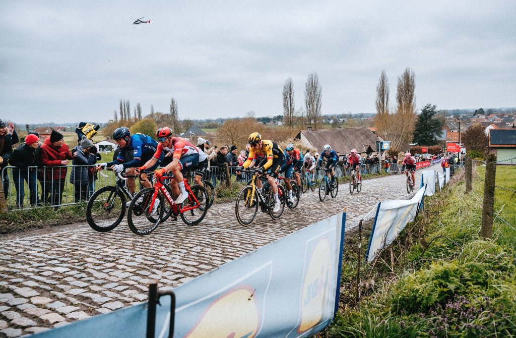A star-studded early breakaway in the Tour of Flanders: Stefan Kung, Mads Pedersen, Nathan Van Hooydonck and others climb a cobbled hellingen ahead of the chase.