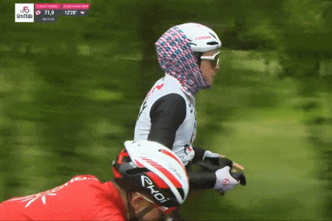 GIF of Alex Baudin of AG2R Citroën wringing out his sopping wet gloves on a sopping wet stage 14 of the 2023 Giro d'Italia.