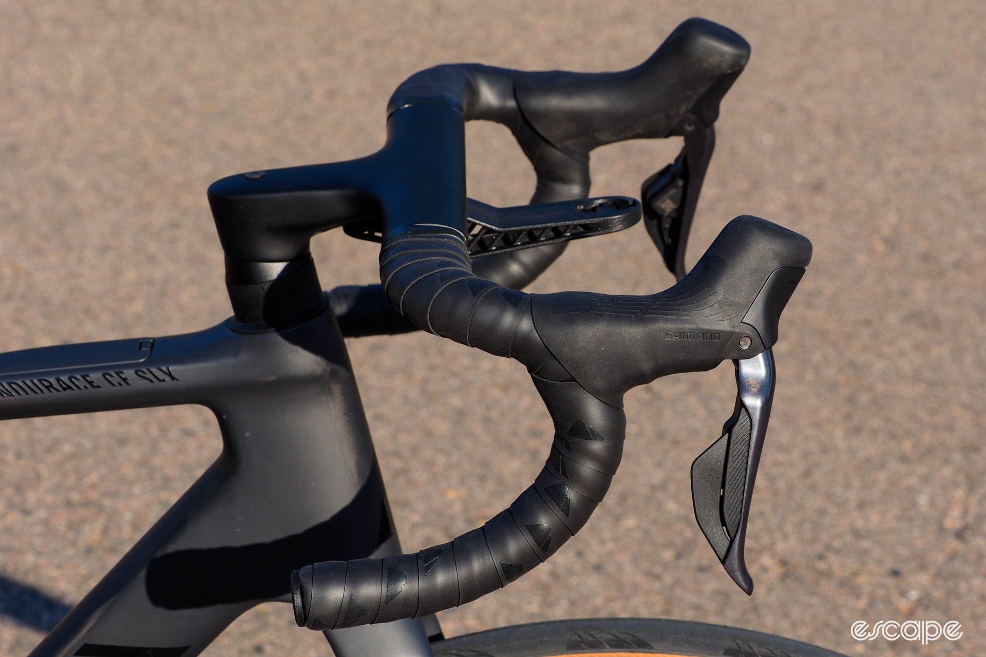 The Canyon CP0018 Aerocockpit has a long reach and deep drops. It's covered in cushy, grippy bar tape and is comfortable, if you like long/deep reach and drop.
